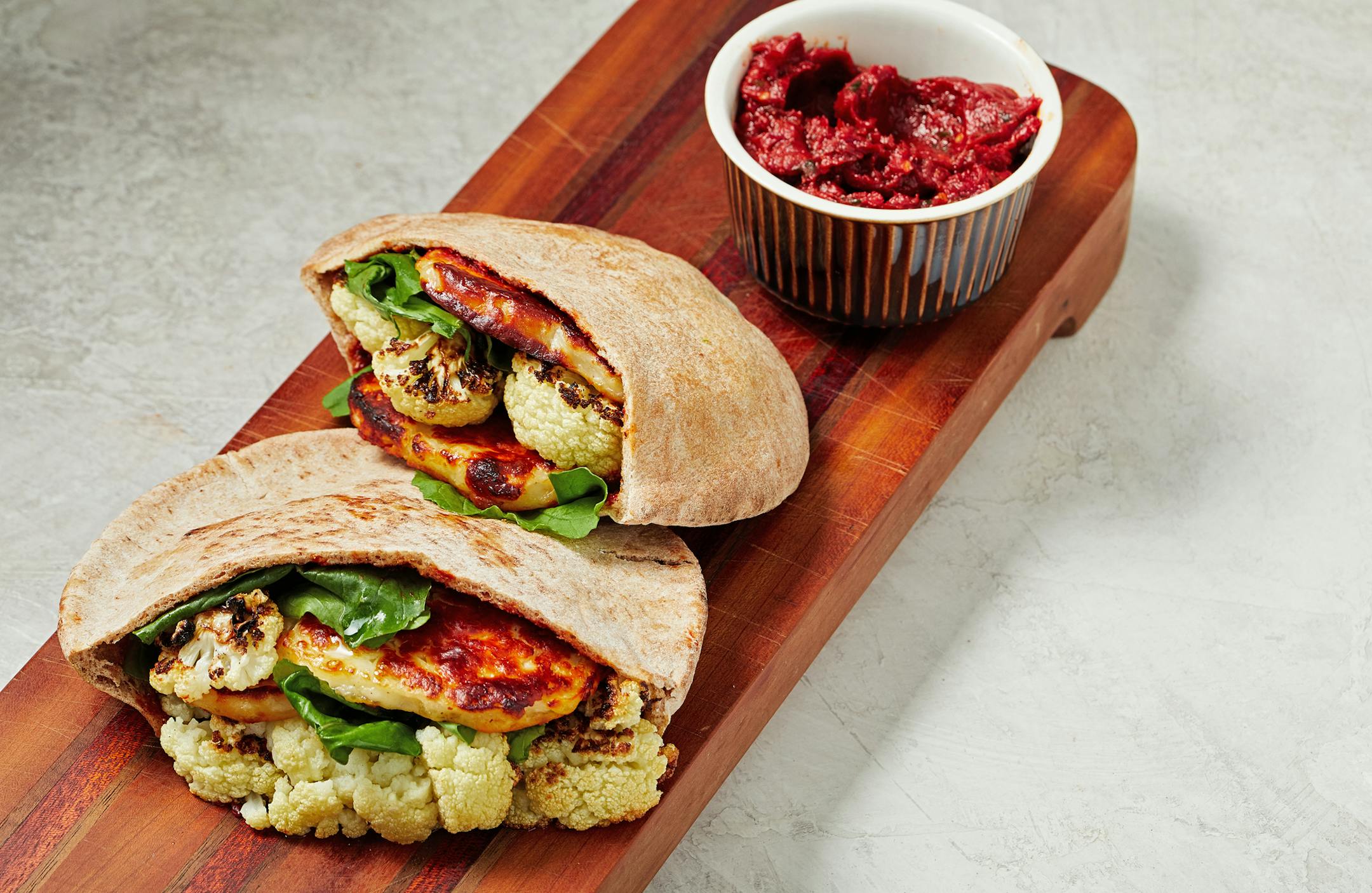 Charred Cauliflower and Halloumi Pitas With Harissa.