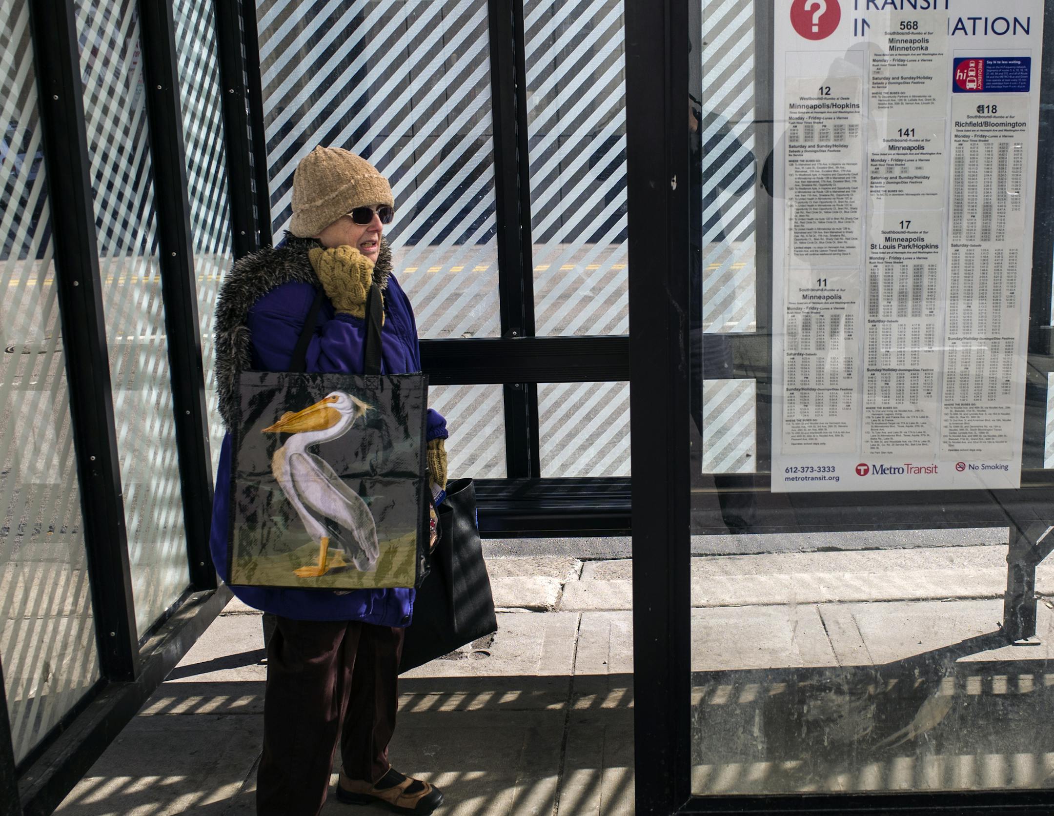 At a bus stop on Hennepin Ave in downtown Minneapolis, Judith Schuller tried to stay warm while waiting for the bus to get back to South Minneapolis after running errands.] Richard Tsong-Taatarii/rtsong-taatarii@startribune.com