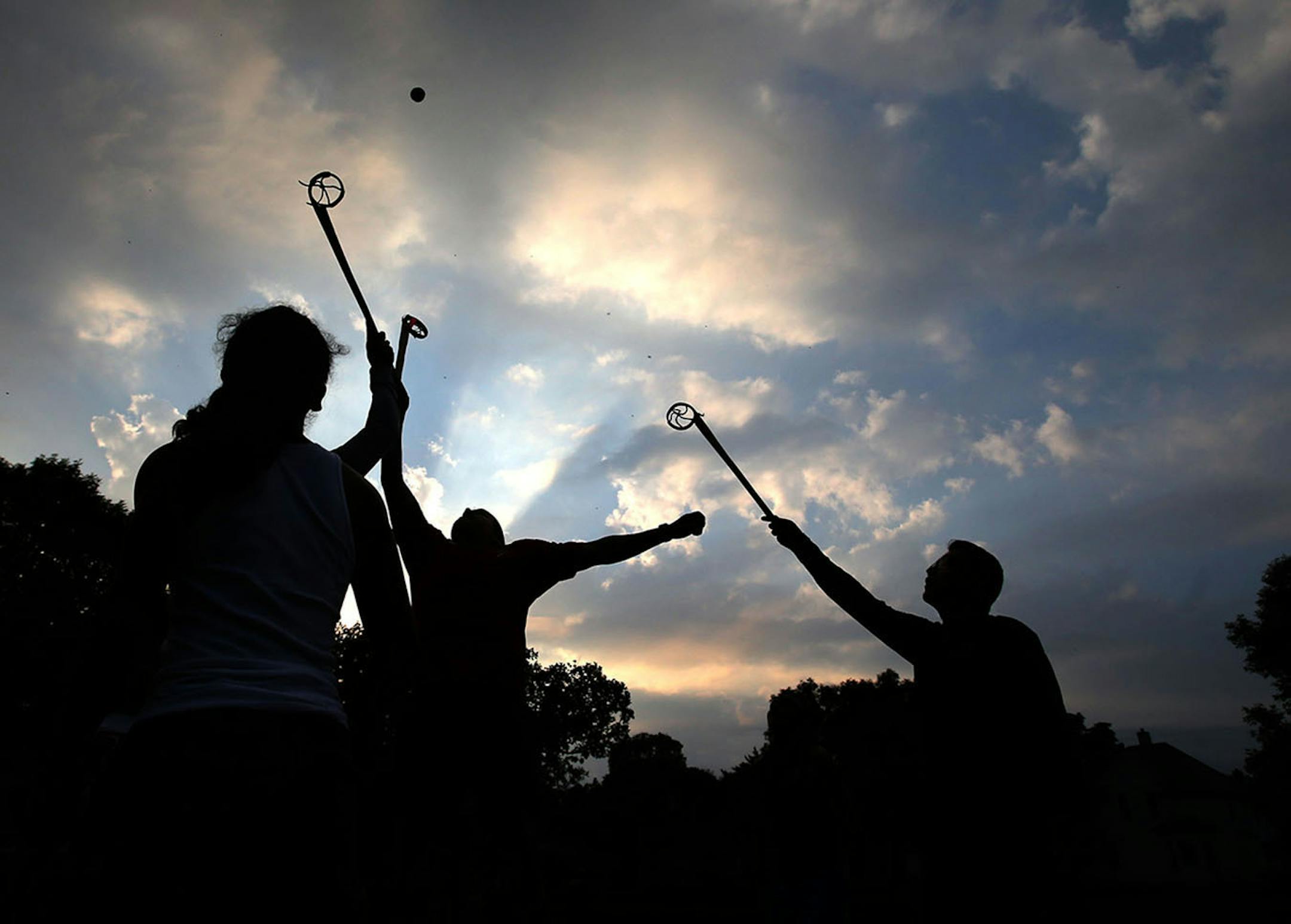 Men who are part of Twin Cities Native Lacrosse practice at Corcoran Park Wednesday, June 17, 2015, in Minneapolis, MN. The traditional Lacrosse players, who play with hand carved ash sticks, were preparing for the upcoming Twin Cities Native Lacrosse Tournament at the Osseo High School Saturday. Here,