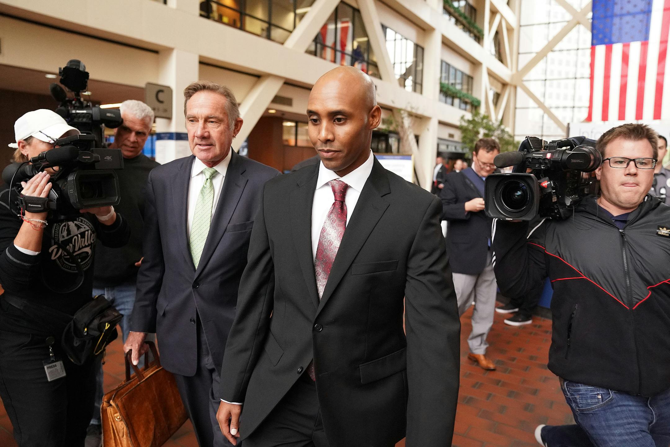 Mohamed Noor, accompanied by his legal team, Peter Wold, and Tom Plunkett left after a probable cause hearing for the ex-Minneapolis cop Thursday at the Hennepin County Government Center. ] ANTHONY SOUFFLE • anthony.souffle@startribune.com Mohamed Noor, accompanied by his legal team, Peter Wold, and Tom Plunkett arrived to argue pretrial motions at a probable cause hearing for the ex-Minneapolis cop Thursday, Sept. 27, 2018 at the Hennepin County Government Center in Minneapolis. The hear