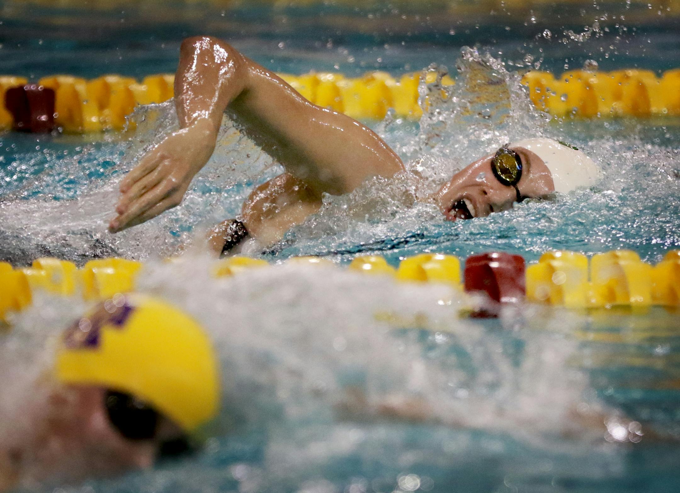 Edina's Kelli McCarthy, top, won the 500-yard freestyle in a time of 4:52.03 in the Class 2A girls' swimming and diving state meet.