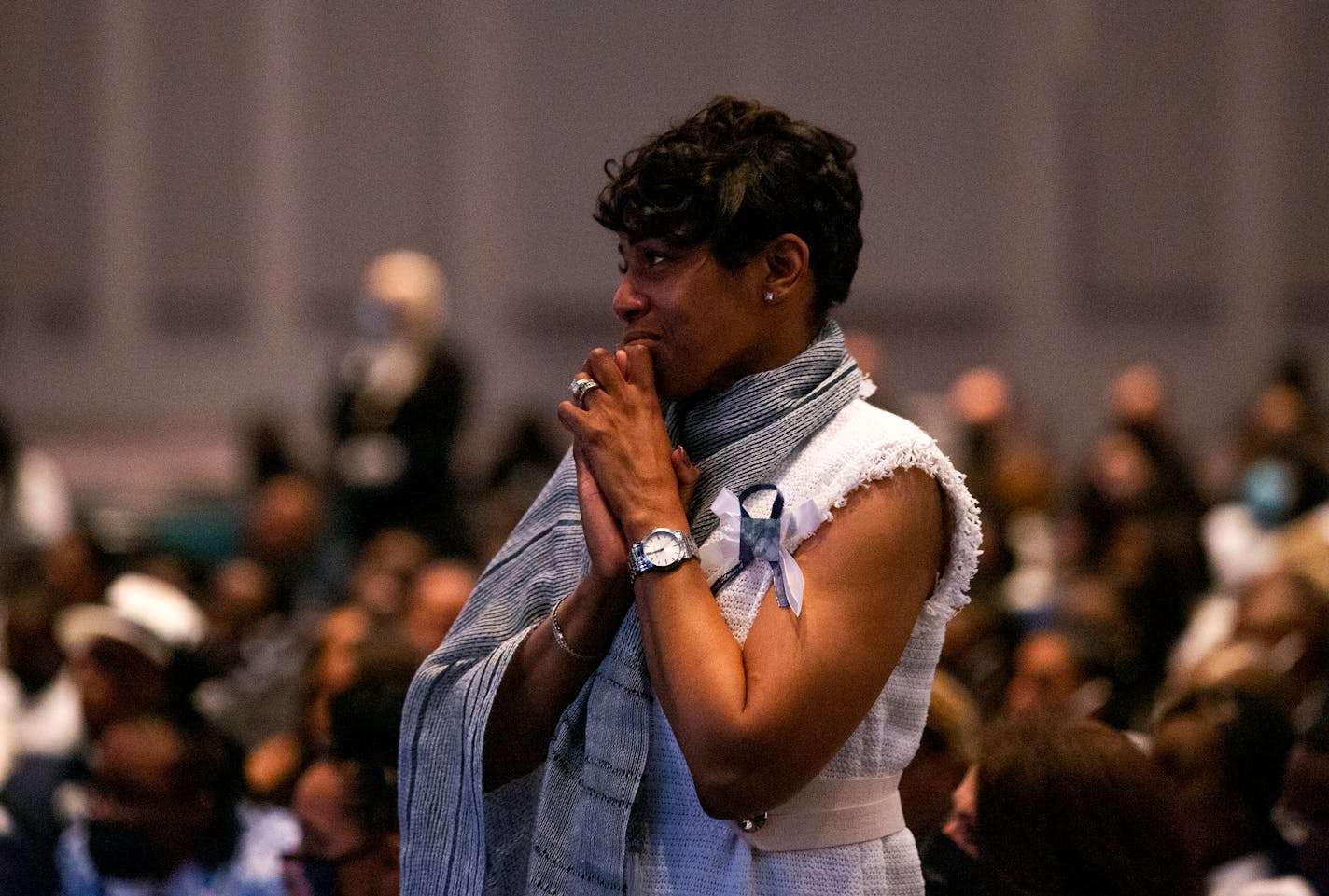 Twauna Hennessee, the mother of Jalon Yoakum and an elder at Mannahouse Church, prays during her son's funeral. MUST CREDIT: photo for The Washington Post by Alisha Jucevic.