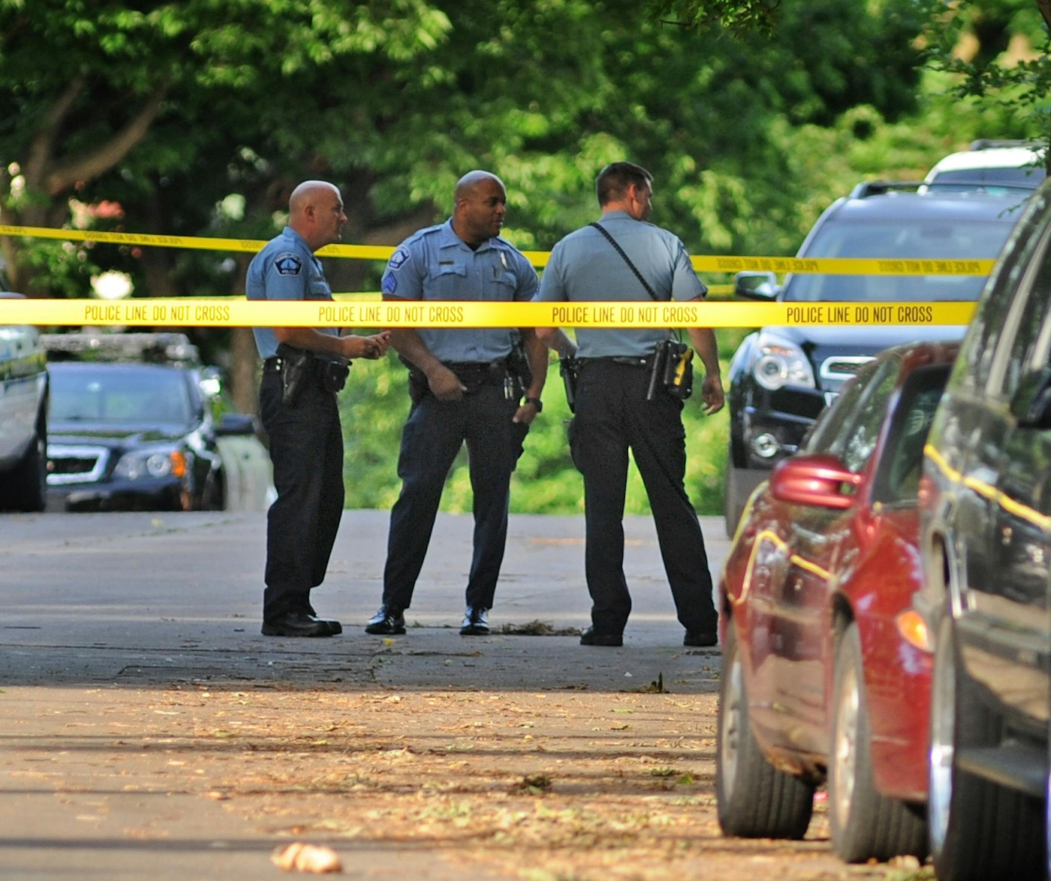 Police at scene where a man was shot to death in a north Minneapolis home in June.