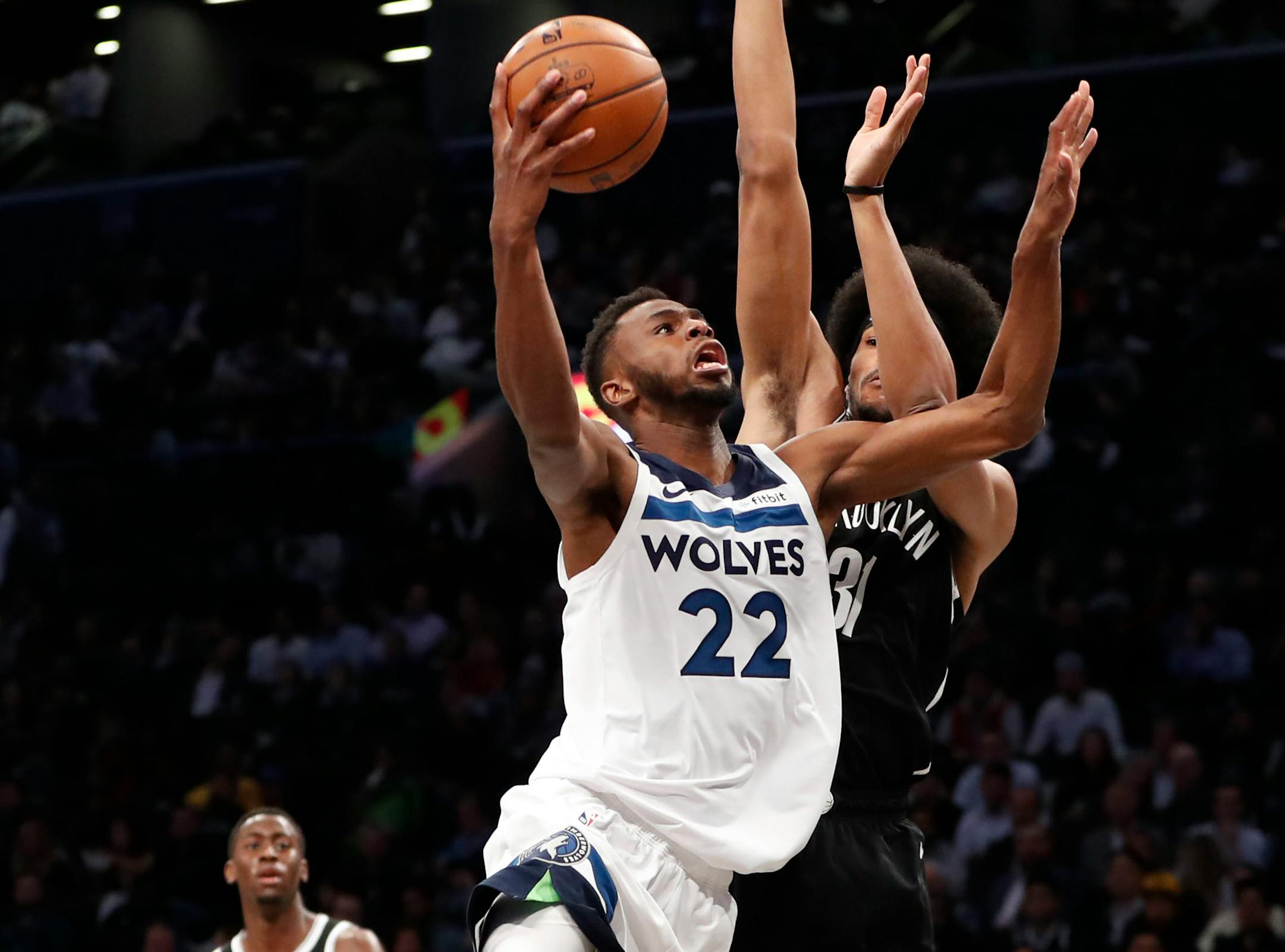 Nets center Jarrett Allen defends against Timberwolves forward Andrew Wiggins during the first half
