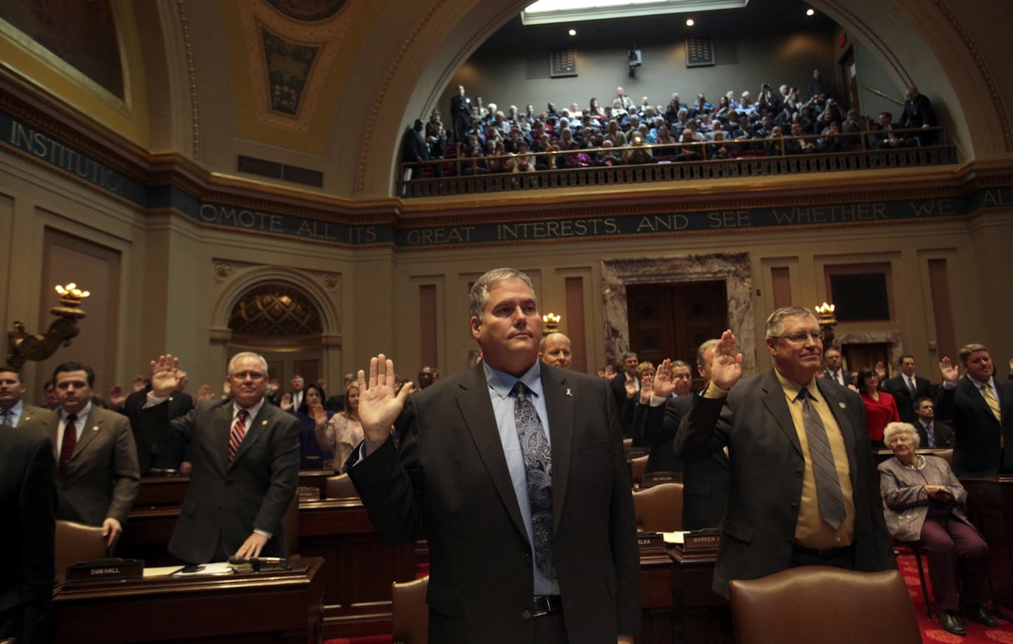 Sen. David Osmek (R), center, takes the oath along with other senators during the opening of the 2013 Minnesota Legislative session Tuesday, Jan. 8, 2013, at the Capitol in St. Paul, MN.