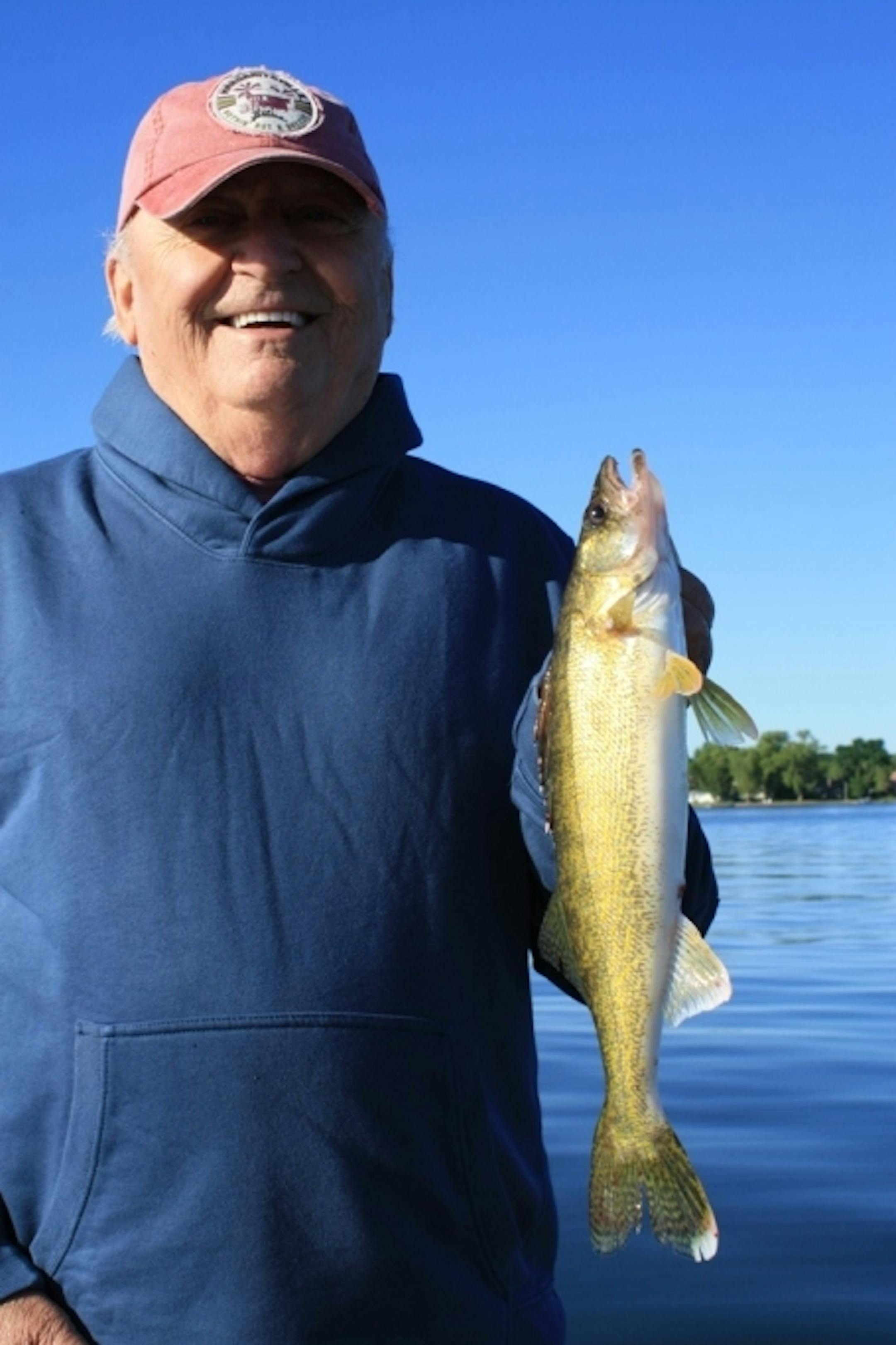 George proudly holds his first walleye ever!