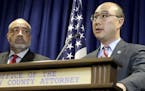 Ramsey County Attorney John Choi, center, surrounded by other law enforcement officials, announces Wednesday, Nov. 16, 2016, that Minnesota police off