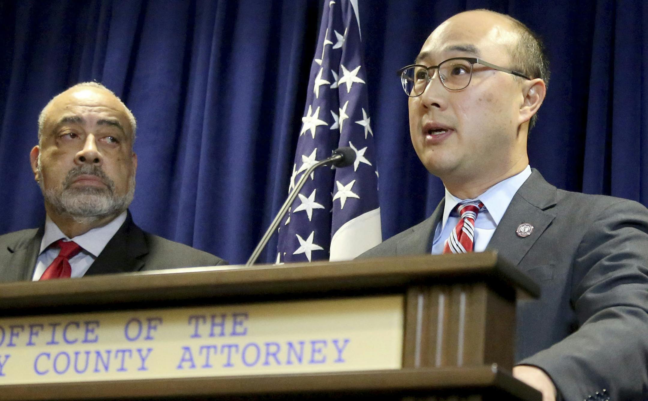 Ramsey County Attorney John Choi, center, surrounded by other law enforcement officials, announces Wednesday, Nov. 16, 2016, that Minnesota police officer Jeronimo Yanez has been charged with second-degree manslaughter in the killing of Philando Castile, a black man whose girlfriend streamed the gruesome aftermath of the fatal shooting live on Facebook. Standing to Choi's left is Don Lewis, special prosecutor in the case and to his right is Richard Dusterhoft, criminal division director at the R