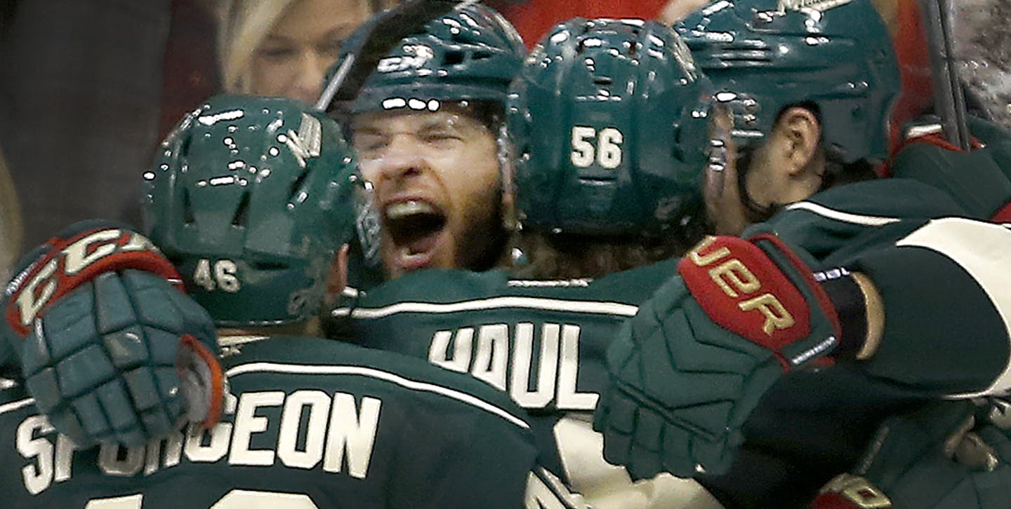 Jason Pominville celebrated with teammates after scoring a goal in the second period. ] CARLOS GONZALEZ cgonzalez@startribune.com - April 20, 2016, St. Paul, MN, Xcel Energy Center, NHL, Hockey, Minnesota Wild vs. Dallas Stars, First Round Stanley Cup Playoffs, Game 4