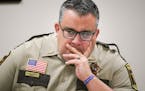Hennepin County Sheriff Dave Hutchinson presided over a Monday morning weekly planning meeting at the Sheriff's Department, Minneapolis City Hall. ] G