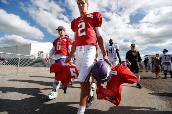 Vikings rookie quarterback Joel Stave carried equipment for veterans Shaun Hill (6) and Teddy Bridgewater after practice.