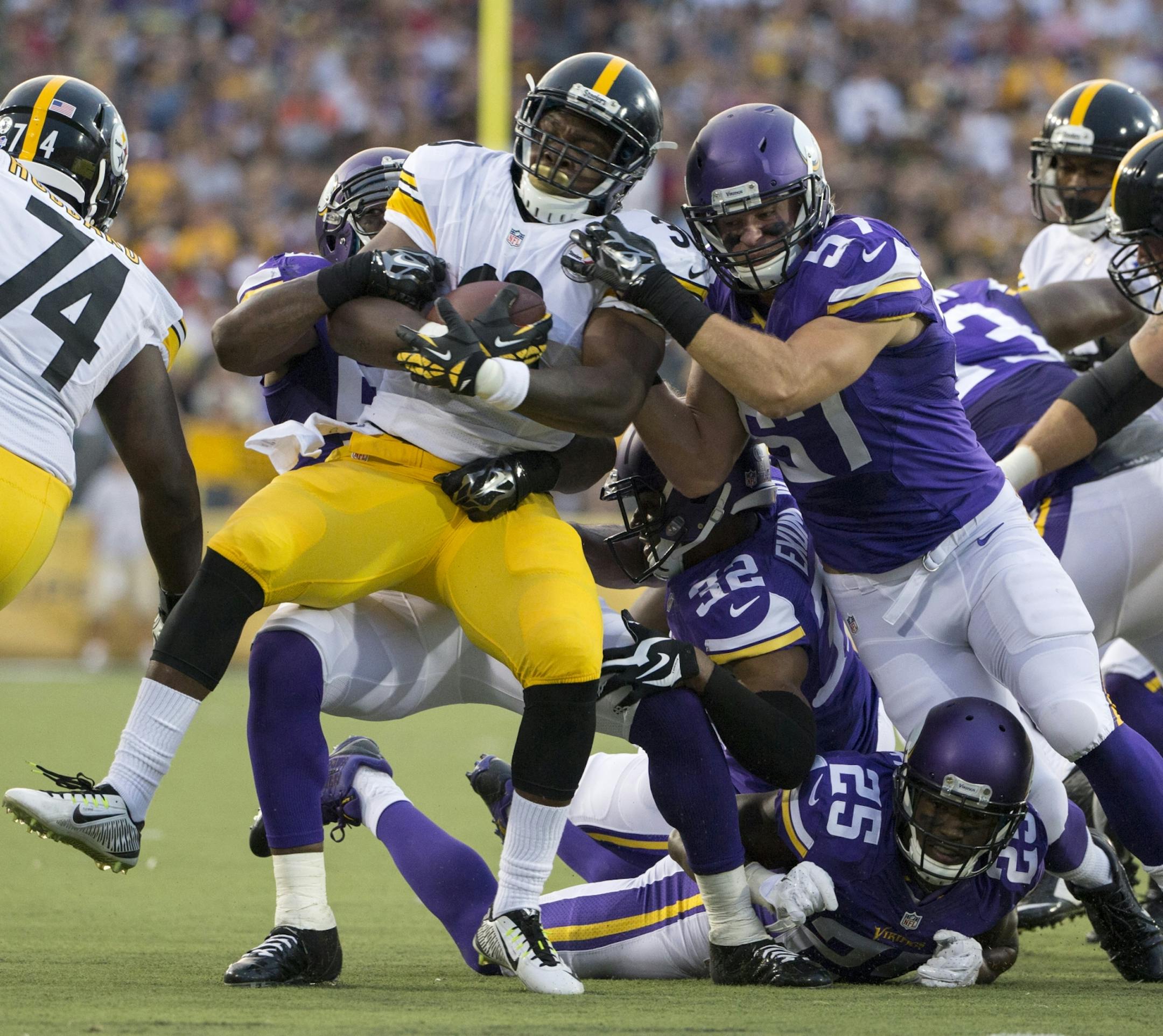 The Vikings defence stops Steelers Kevin Fogg in teh 1st quarter.