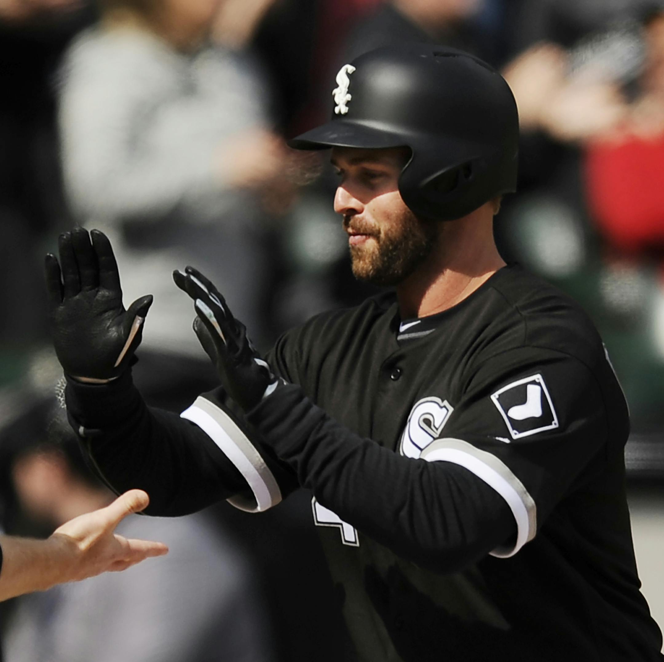 Chicago White Sox's Matt Davidson right, celebrates with Todd Fraizer (21) at home plate after hitting a three-run home run during the fourth inning of a baseball game against the Detroit Tigers pm Thursday, April 6, 2017, in Chicago. (AP Photo/Paul Beaty)