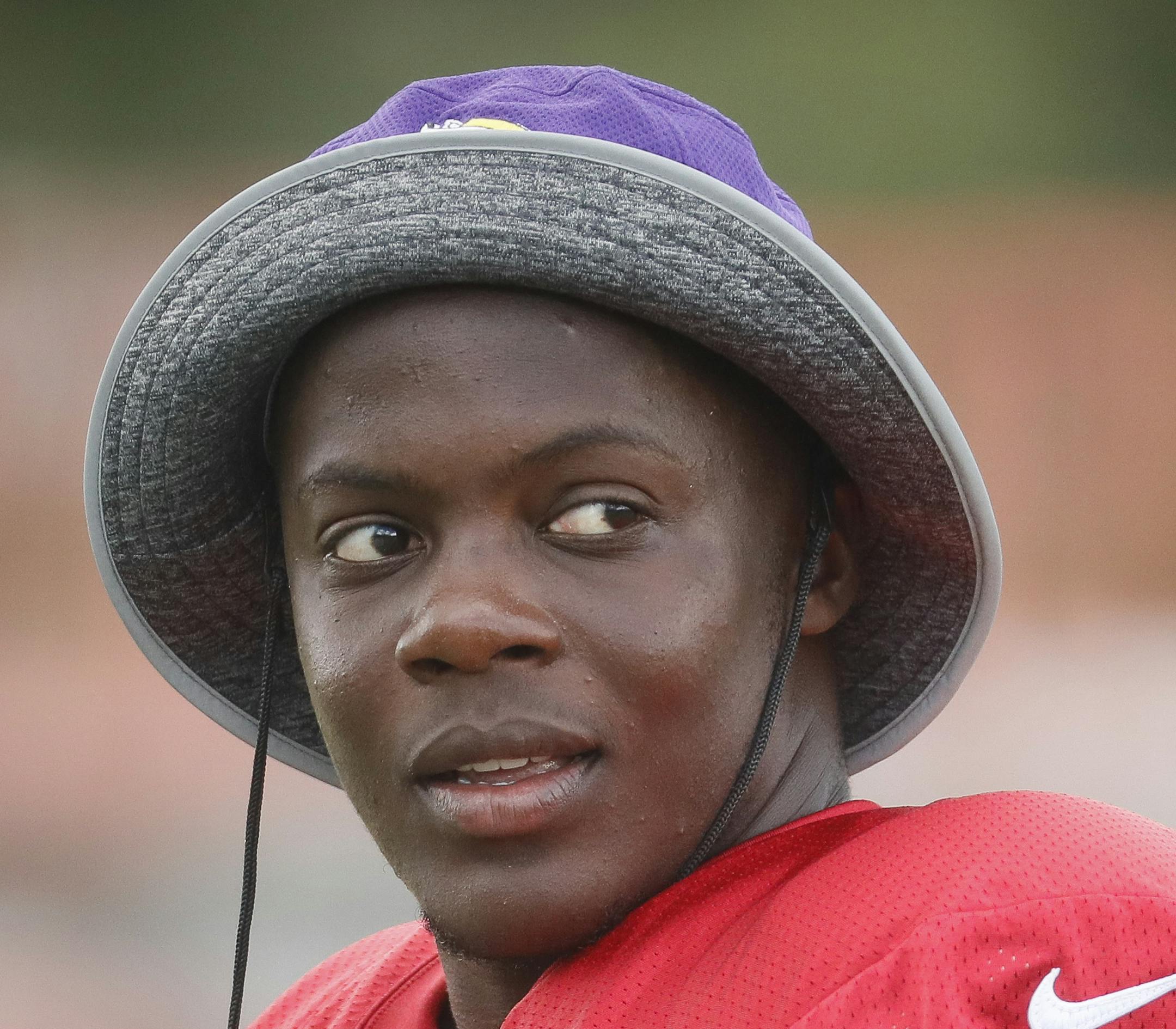 Minnesota Vikings quarterback Teddy Bridgewater walks the field following a joint NFL football practice with the Cincinnati Bengals, Thursday, Aug. 11, 2016, in Cincinnati. (AP Photo/John Minchillo)