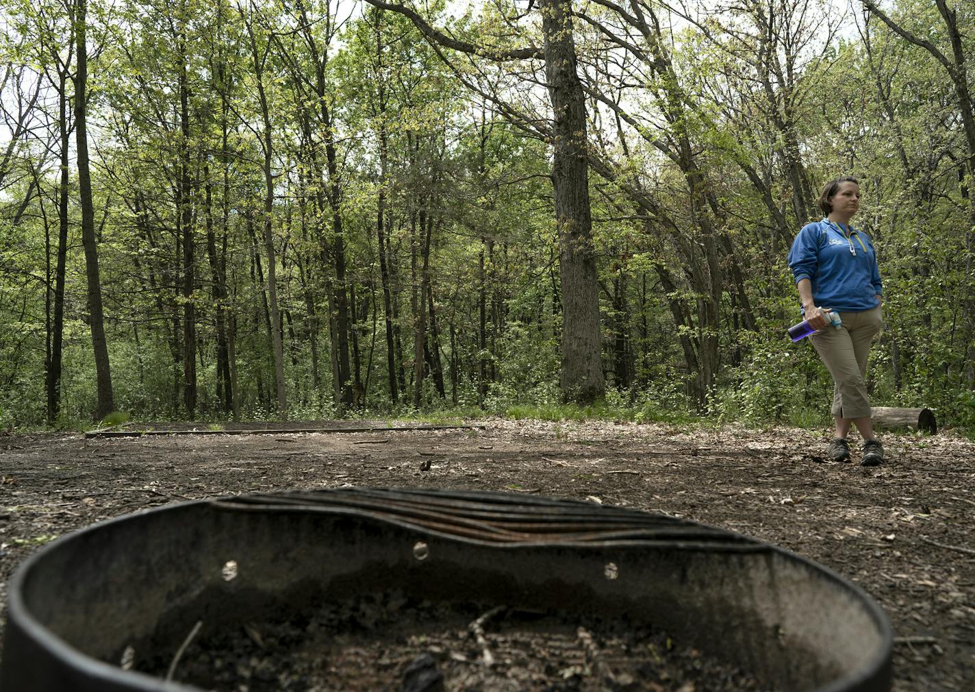 Minnesota DNR Parks and Trails Division director Erika Rivers stands at a remote camp site at Afton State Park.. Some state parks will open to campers June 1.