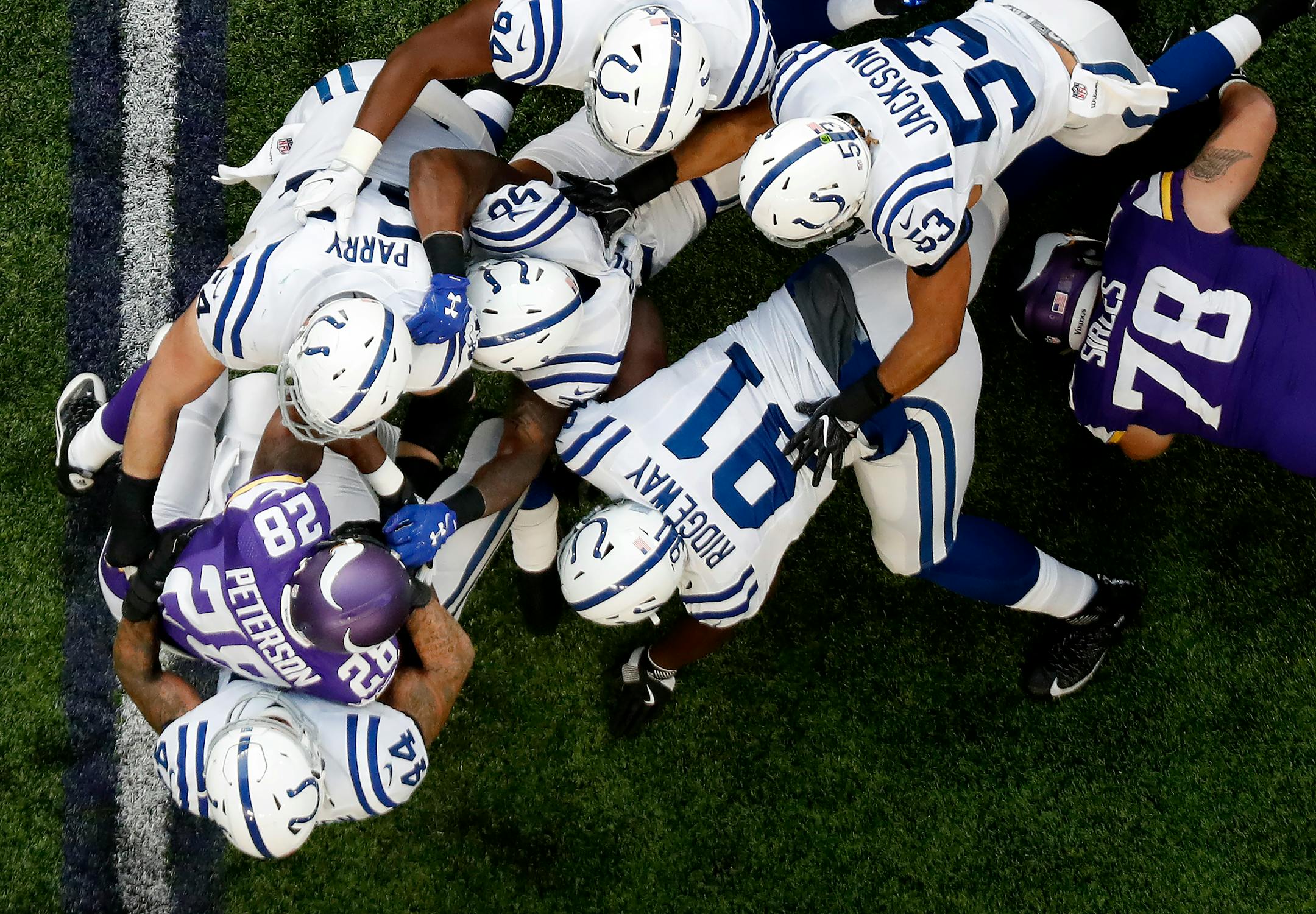 Minnesota Vikings running back Adrian Peterson was tackled by a group of Colts defenders in the first quarter. The carry was Peterson's first after returning from a knee injury. ] CARLOS GONZALEZ cgonzalez@startribune.com - December 18, 2016, Minneapolis, MN, US Bank Stadium, NFL, Minnesota Vikings vs. Indianapolis Colts