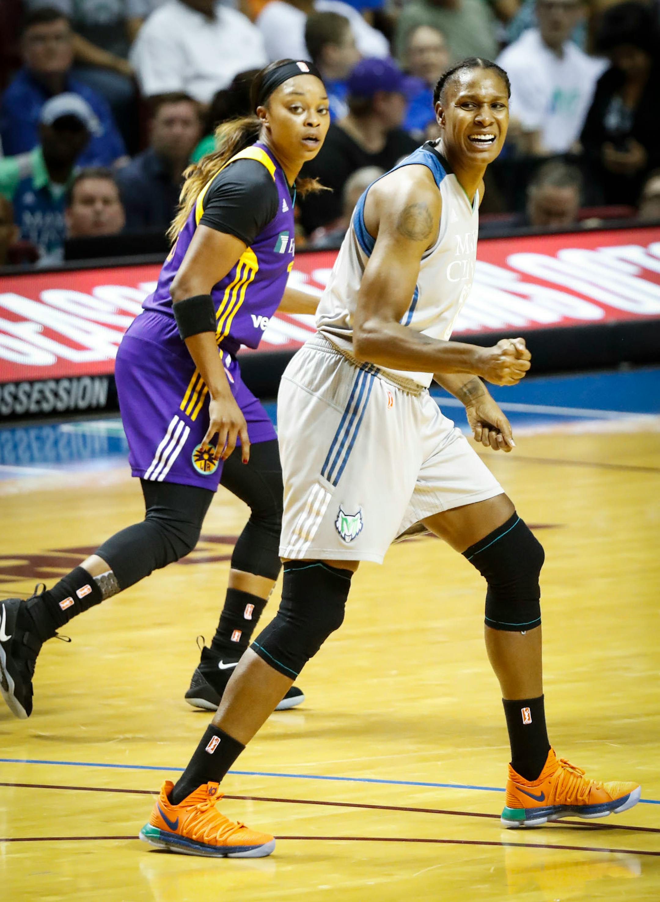 Minnesota Lynx forward Rebekkah Brunson (32) reacted after missing a basket during the first half. Behind her is L.A.'s Los Angeles Sparks guard Odyssey Sims (1).