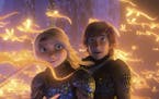 This image released by Universal Pictures shows characters Astrid, voiced by America Ferrera, left, and Hiccup, voiced by Jay Baruchel, in a scene fro