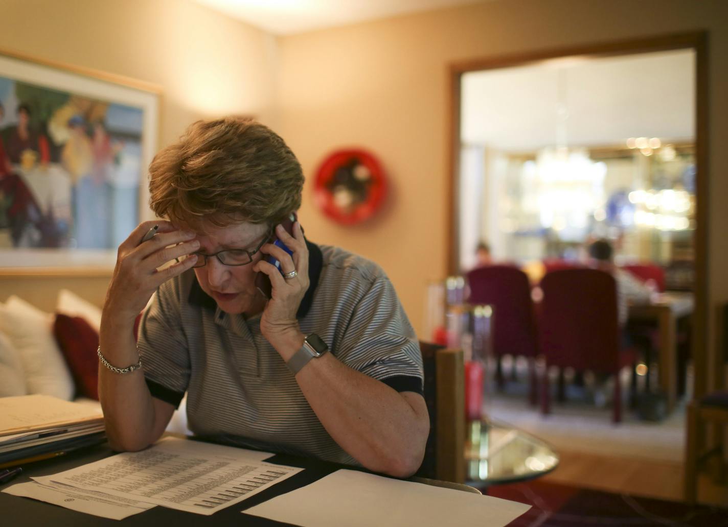 Clinton volunteer Charlaine Tolkien made phone calls in her living room while hosting a phone bank event in her home in Brooklyn Park Thursday night. ] JEFF WHEELER &#xef; jeff.wheeler@startribune.com Hillary Clinton is already building a traditional campaign operation in Minnesota, despite the state's long history of electing Democrats for president. On Thursday night, June 30, 2016, Charlaine Tolkien hosted a phone bank event with volunteers making calls from her Brooklyn Park home.