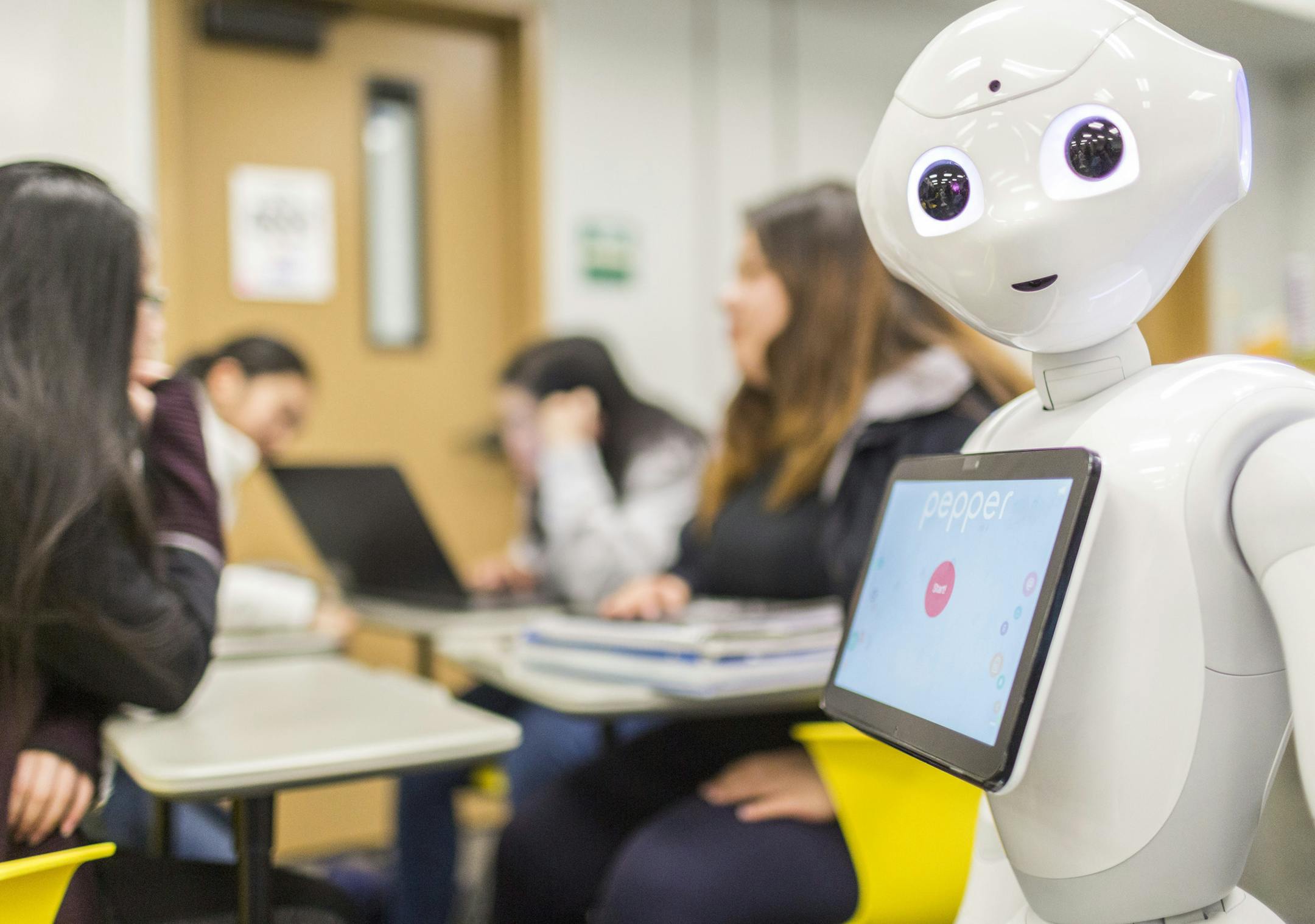 IMAGE DISTRIBUTED FOR SOFTBANK GROUP - SoftBank Group, in collaboration with SoftBank Robotics America, brings the humanoid robot, Pepper, to students in the San Francisco Unified School District. Students at Galileo Academy of Science and Technology learn how to program robots on Wednesday, Dec. 5, 2018, in San Francisco. (Eric Kayne/AP Images for SoftBank Group) ORG XMIT: CPALA404