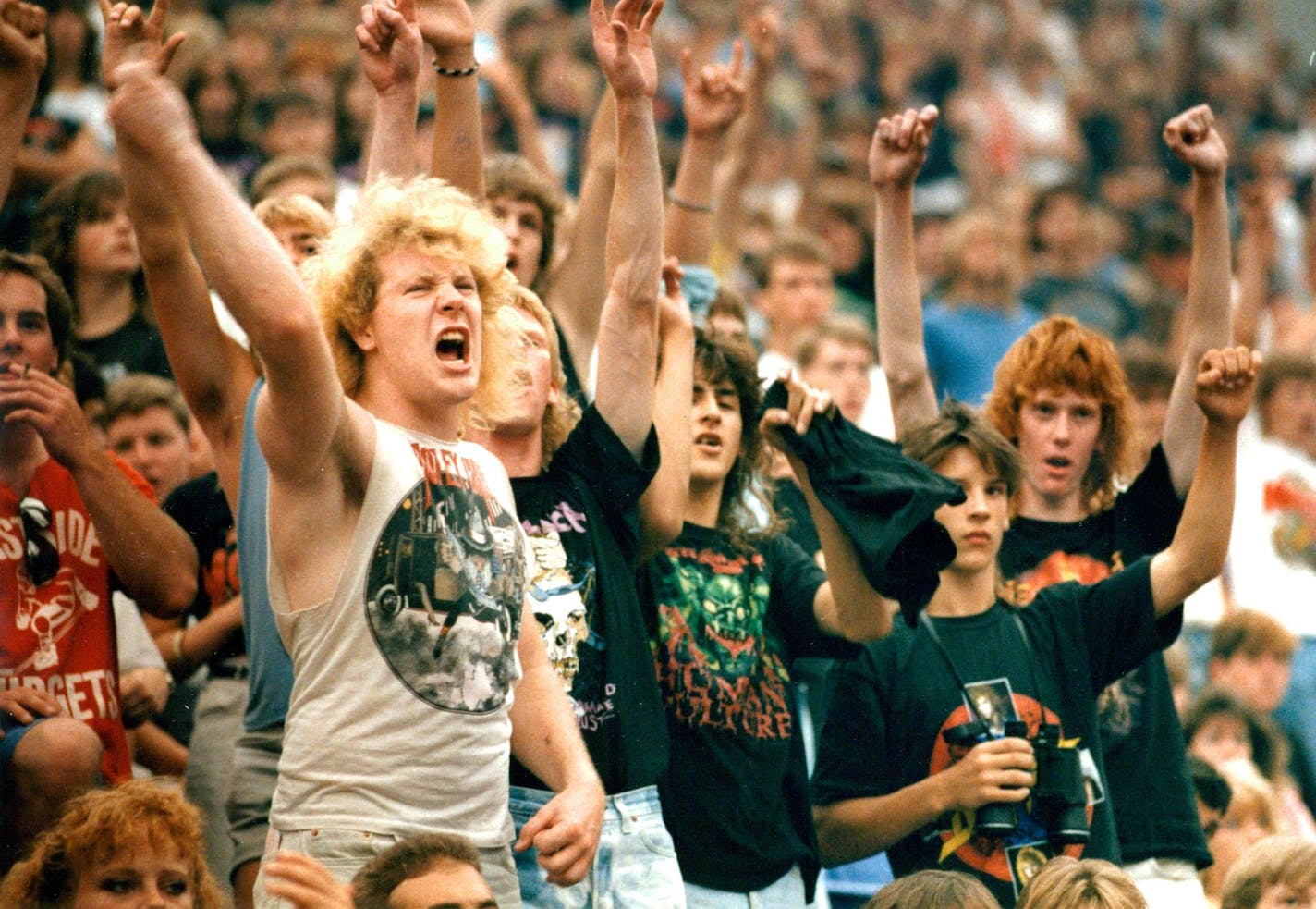 July 11, 1988: Fans cheer on Metallica, during the Monsters of Rock Tour at the Metrodome.