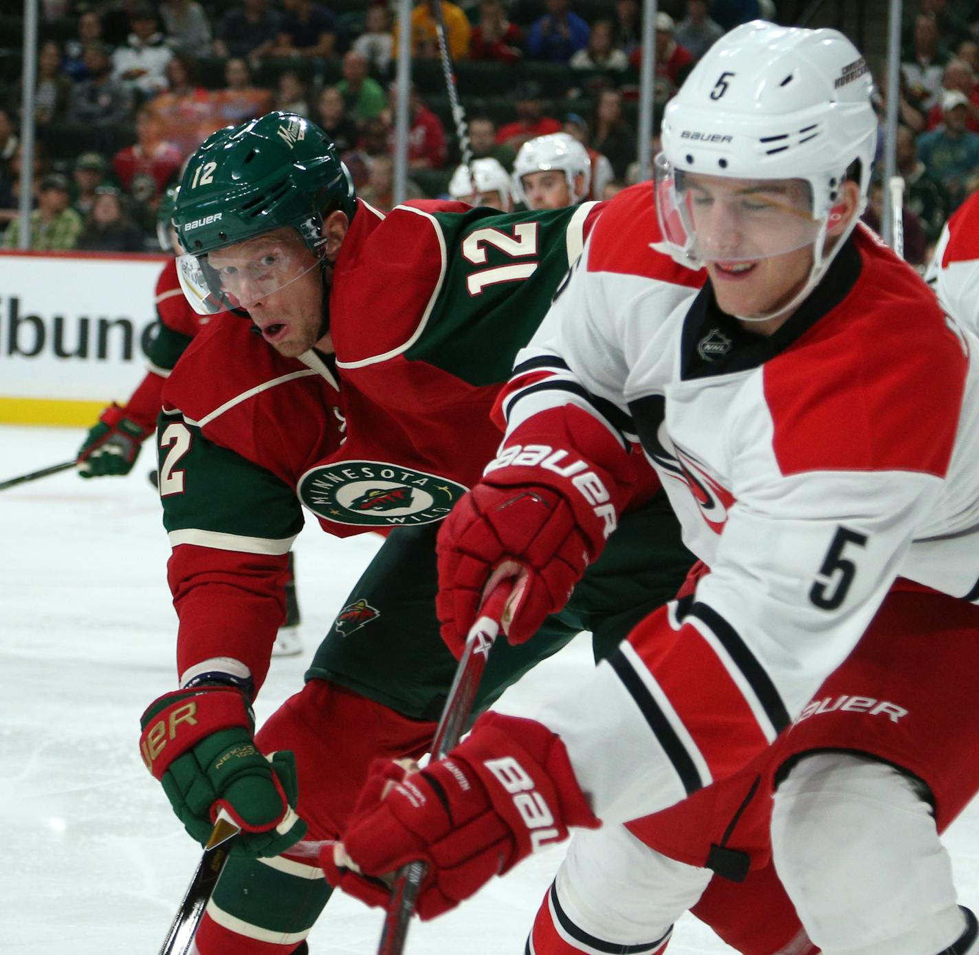 Wild center Eric Staal battled Hurricanes defender Noah Hanifin for control of the puck during the first period. ] Mark Vancleave - mark.vancleave@startribune.com * The Carolina Hurricanes played the Minnesota Wild on Sunday, Oct. 2, 2016 at the Xcel Energy Center in St. Paul, Minn.