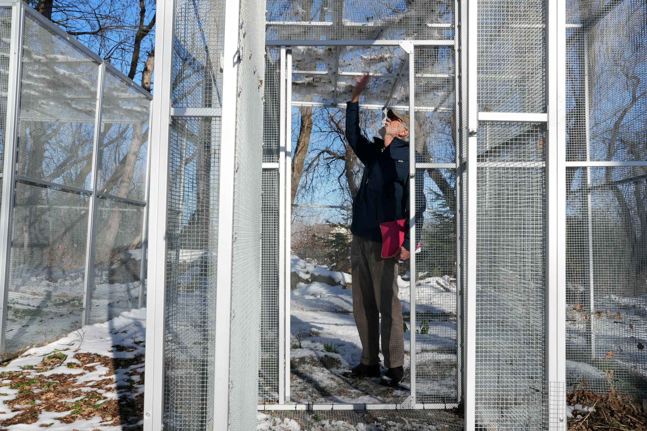 Wildlife Rehabilitation Center executive director Phil Jenni looked over some rehabilitation cages at the site of the proposed expansion.