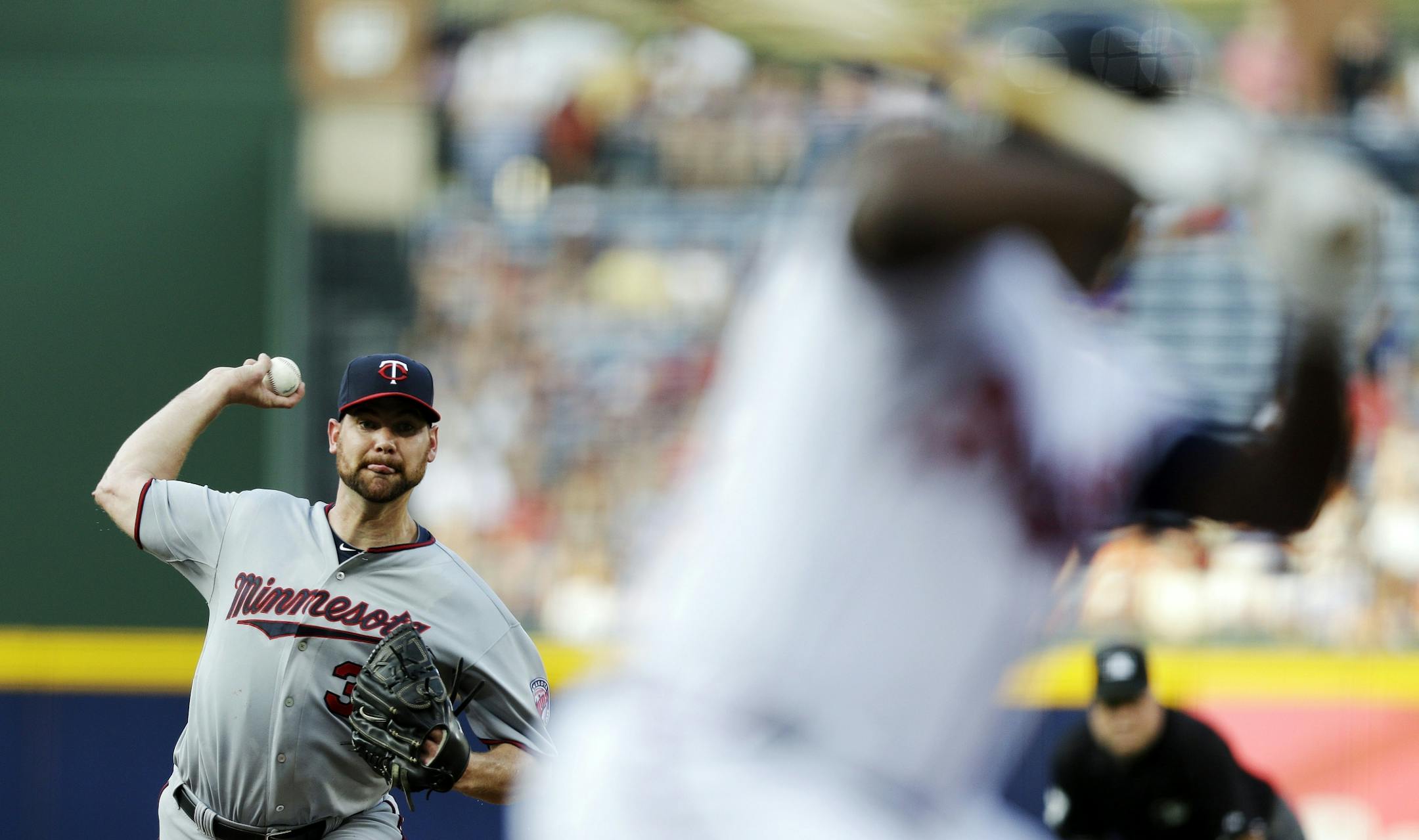 Minnesota Twins starting pitcher Mike Pelfrey works against the Atlanta Braves in the first inning