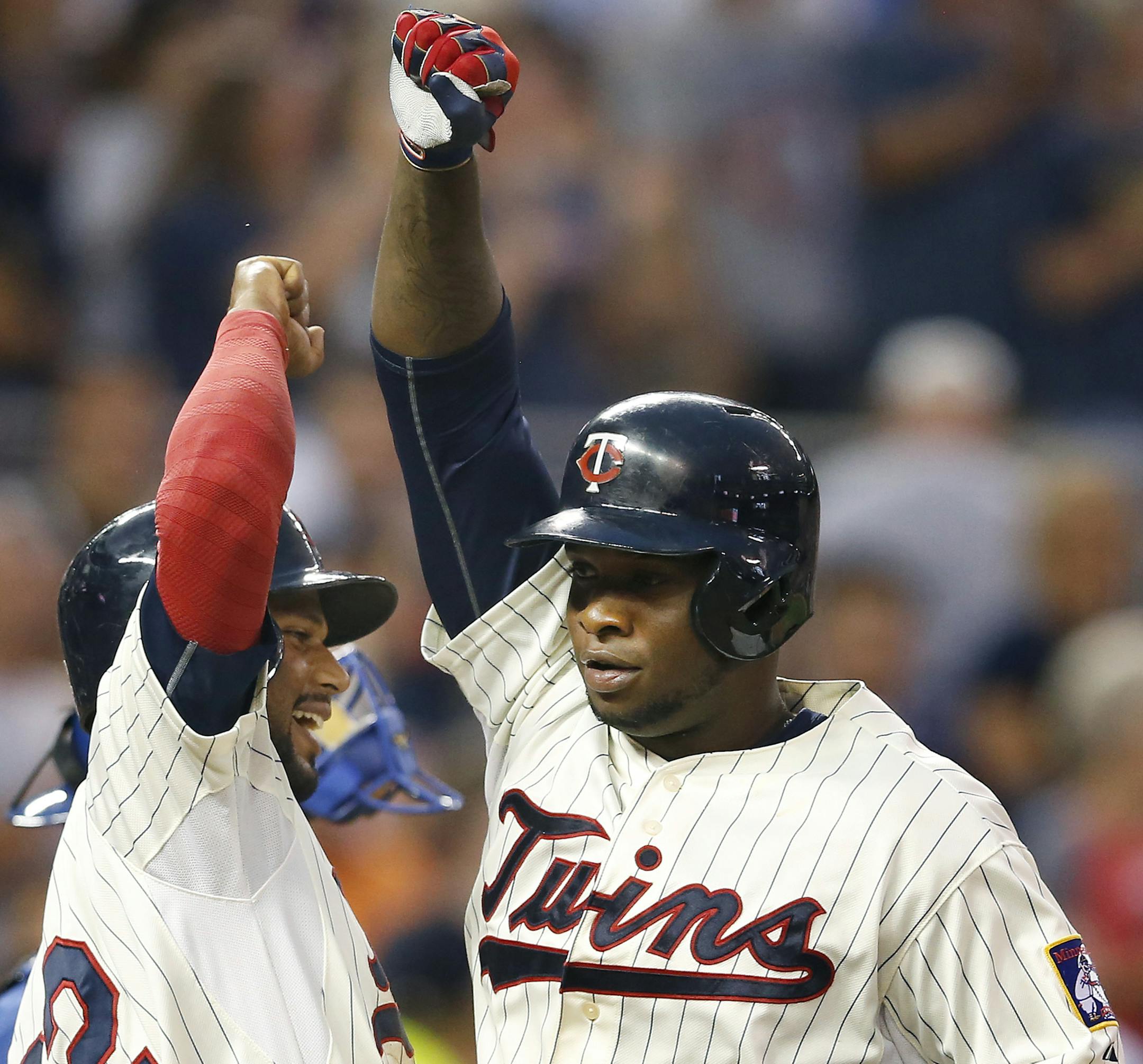 Minnesota Twins Miguel Sano was greeted by Aaron Hicks (32) at home plate after hitting a home run in the fourth inning. The HR was his second of the game. ] CARLOS GONZALEZ cgonzalez@startribune.com - August 12, 2015, Minneapolis, MN, Target Field, Minnesota Twins vs. Texas Rangers