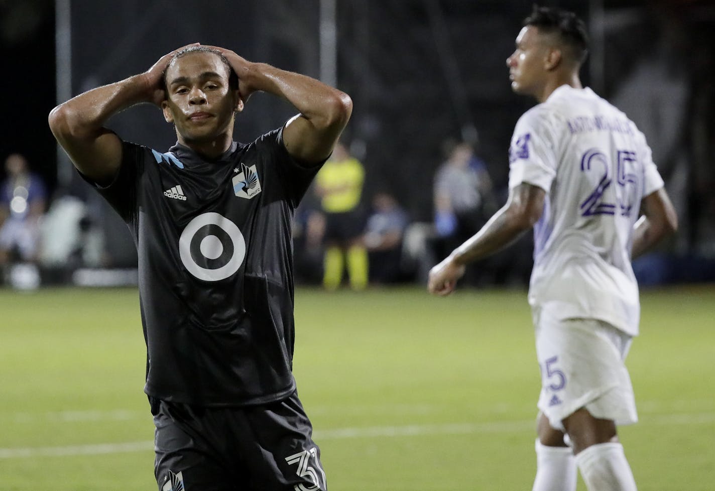 Minnesota United midfielder Hassani Dotson reacts after missing a shot on goal against Orlando City during the second half of an MLS soccer match, Thursday, Aug. 6, 2020, in Kissimmee, Fla. (AP Photo/John Raoux)