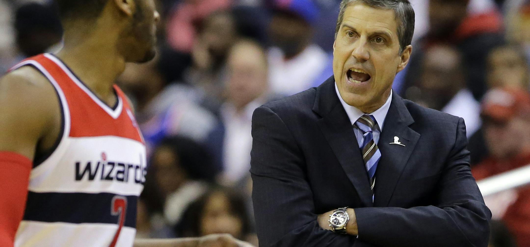 Washington Wizards head coach Randy Wittman talks with guard John Wall (2) in the first half of an NBA basketball game against the New York Knicks, Friday, March 1, 2013, in Washington. The Knicks won 96-88. (AP Photo/Alex Brandon)