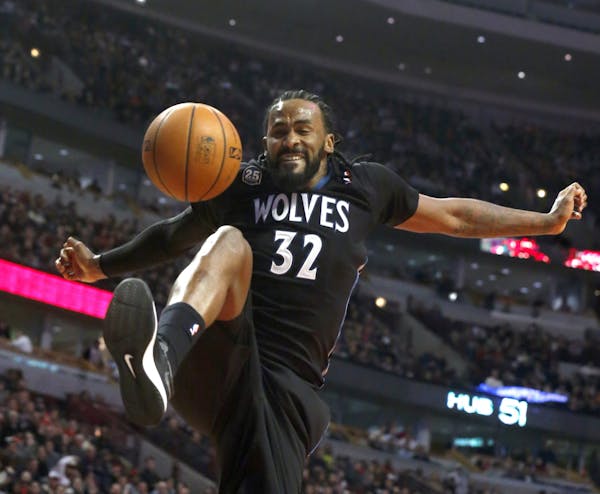 Minnesota Timberwolves center Ronny Turiaf reacts after his dunk during the first half of an NBA basketball game against the Chicago Bulls, Monday, Ja