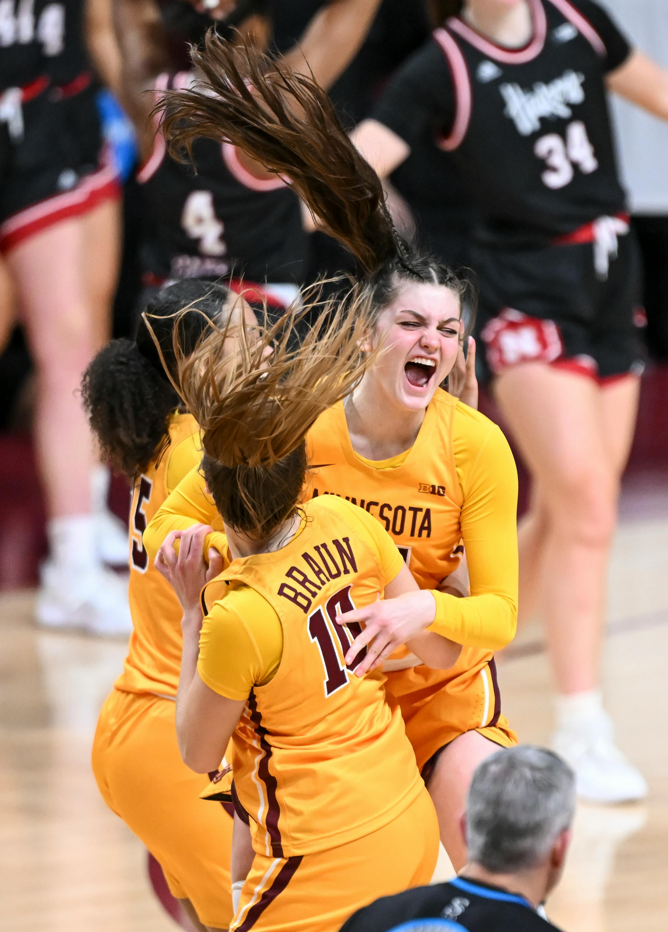 Minnesota guard Mara Braun (10) and guard Isabelle Gradwell (14) celebrate their team's win off of Gradwell's last-second 3-pointer against Nebraska.
