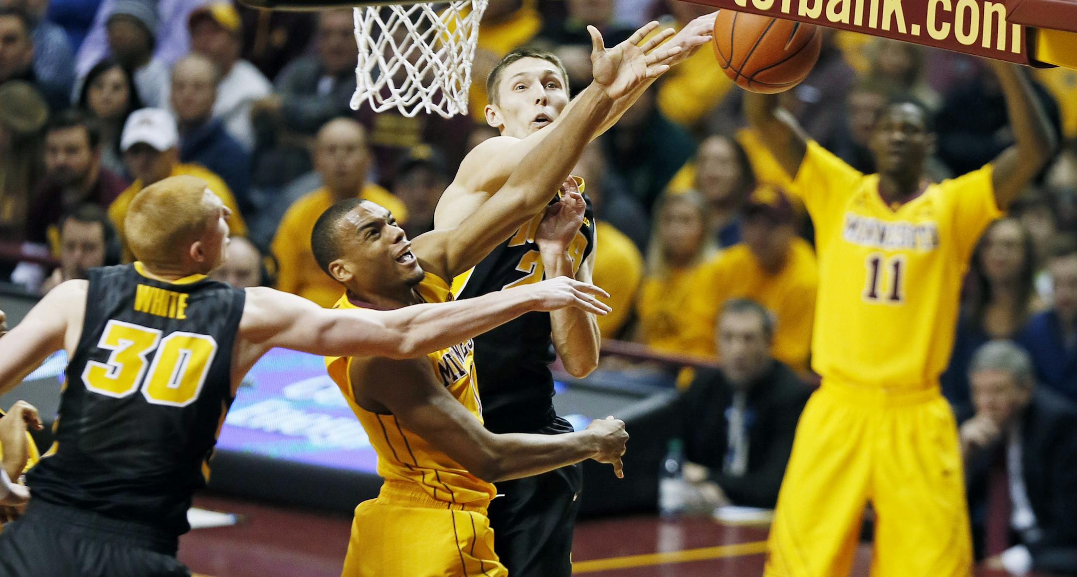 Minnesota Gophers guard Andre Hollins (1) shot was blocked by Iowa Hawkeyes forward Jarrod Uthoff (20) Tuesday at Williams arena January 13, 2015 Minneapolis, MN.] Minnesota hosted Iowa in Big Ten action Tuesday night at Williams Arena.] Jerry Holt/ Jerry.Holt@Startribune.com