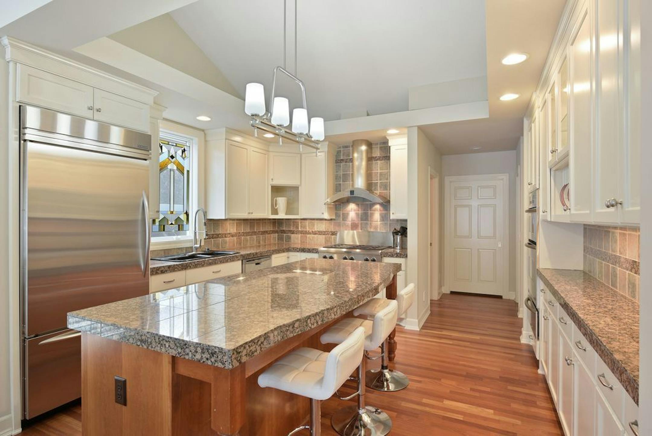 The spacious kitchen with center island also facilitates entertaining.