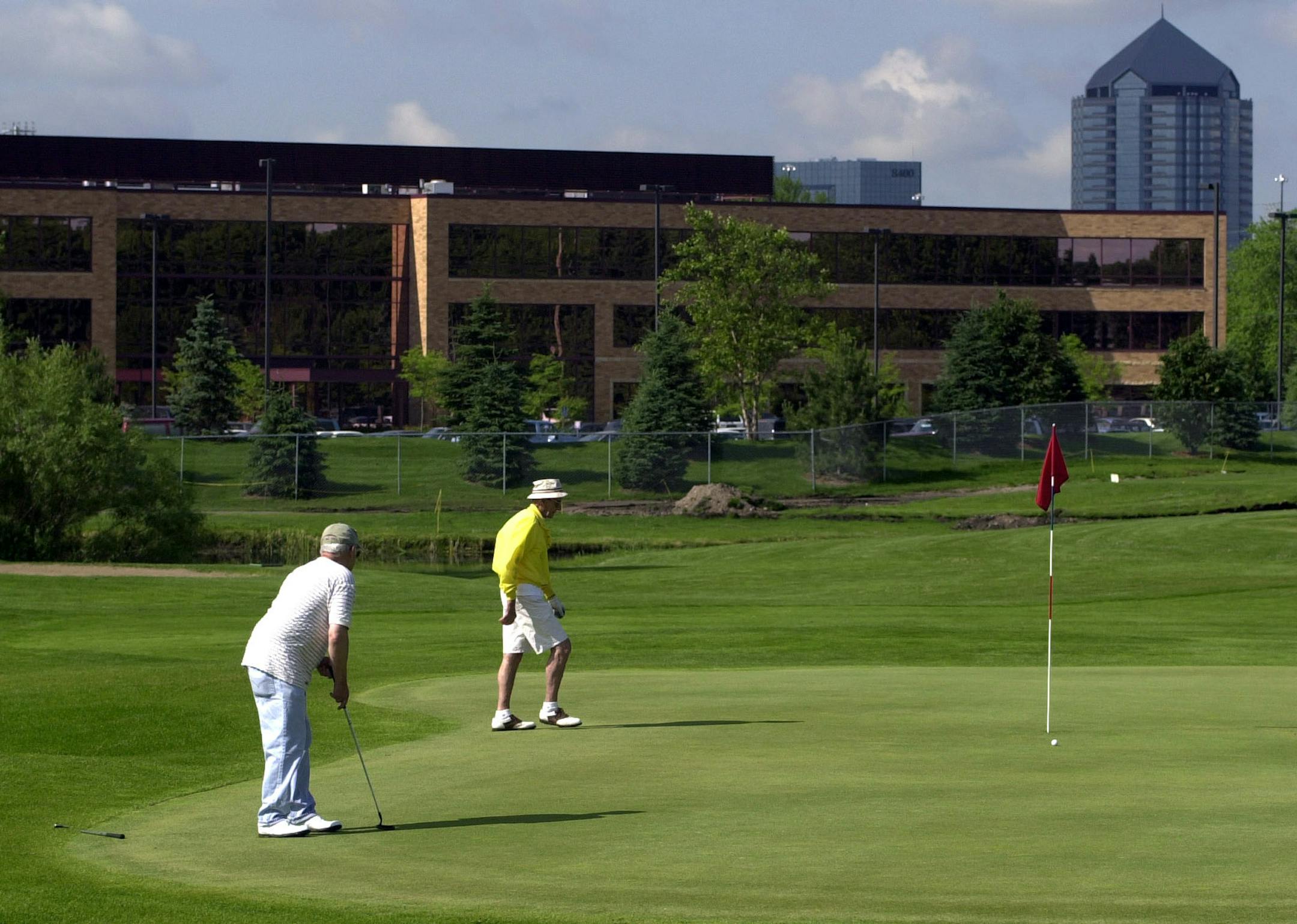 File photo: Two golfers finished up the third hole of the Fred Richards Golf Course..