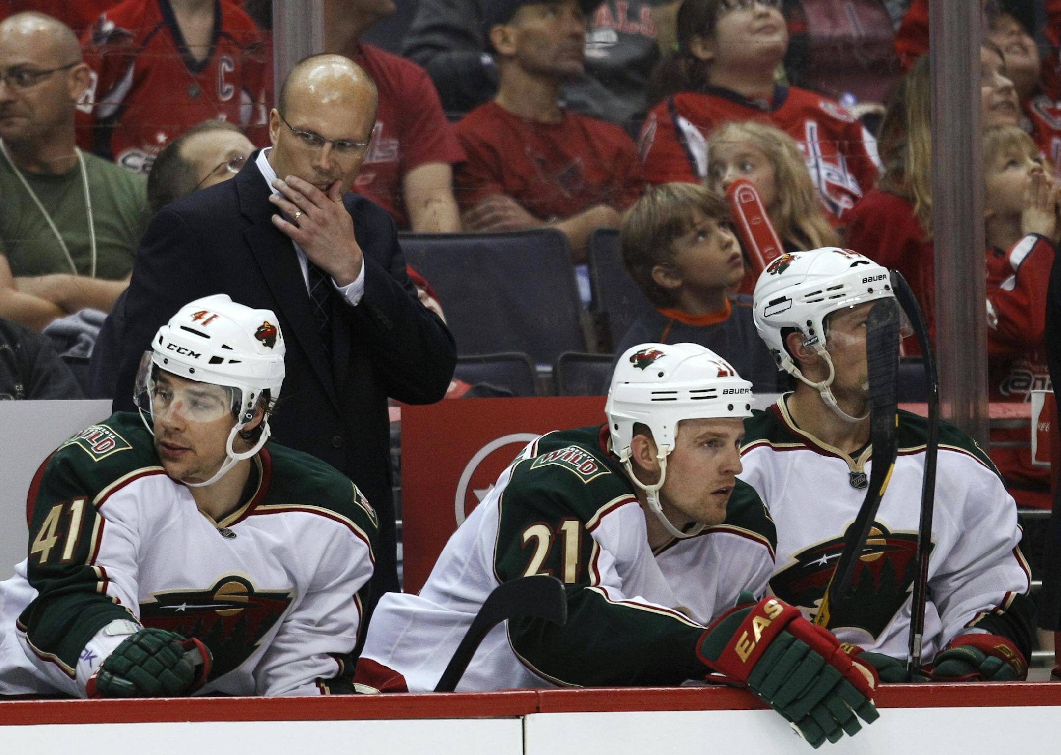 Minnesota Wild defenseman Jared Spurgeon (46) battles for the puck against Washington Capitals left wing Alex Ovechkin (8), of Russia, during the third period of an NHL hockey game, Saturday, Nov. 18, 2017, in Washington.