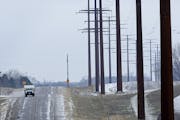 In a 2014 photo, power Lines run along side the road near Cedar Summit Farm in Minnesota. ] BRIAN PETERSON &#xa5; brian.peterson@startribune.com New P