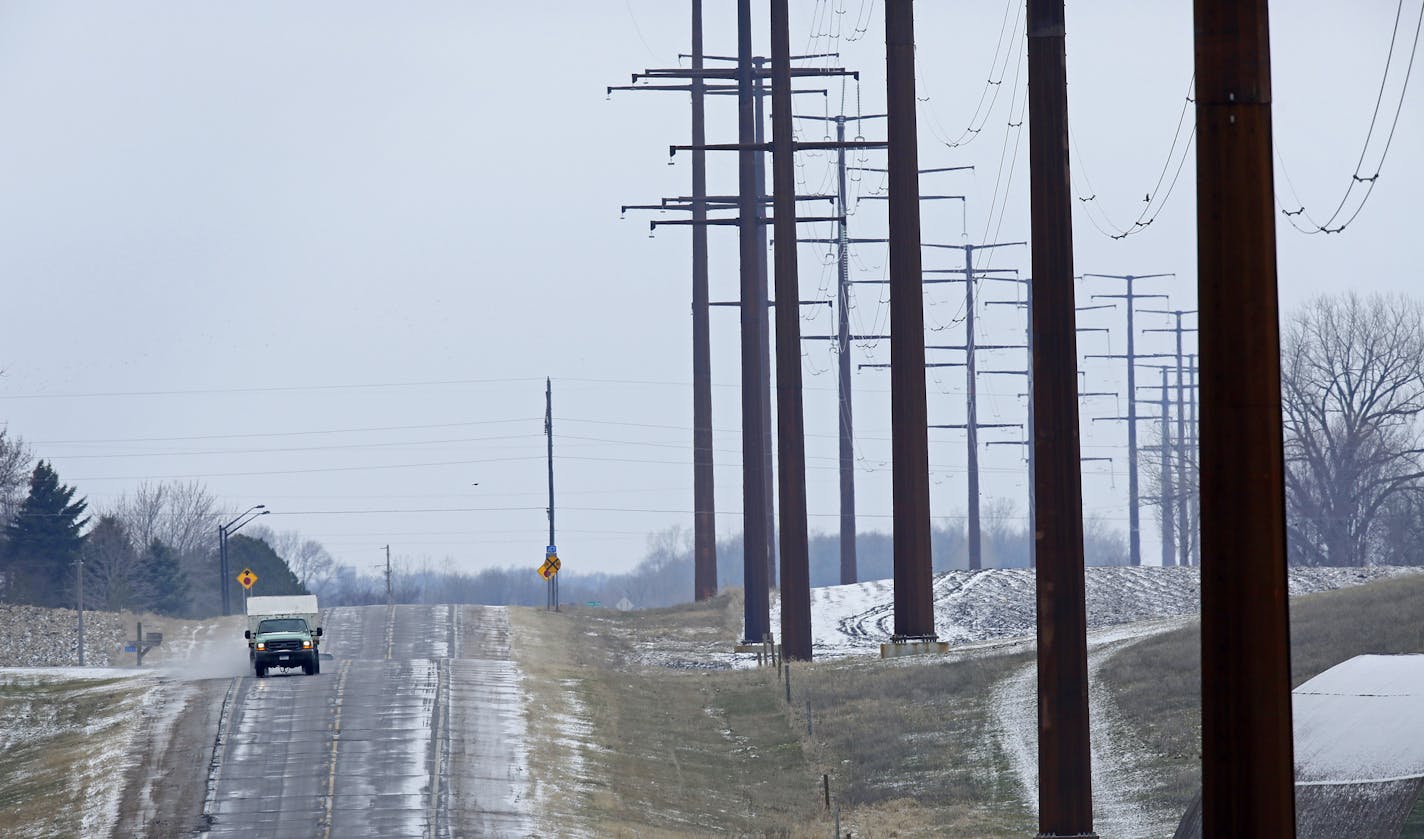 In a 2014 photo, power Lines run along side the road near Cedar Summit Farm in Minnesota. ] BRIAN PETERSON &#xa5; brian.peterson@startribune.com New Prague, MN 4/17/2014 ORG XMIT: MIN1404171455092152