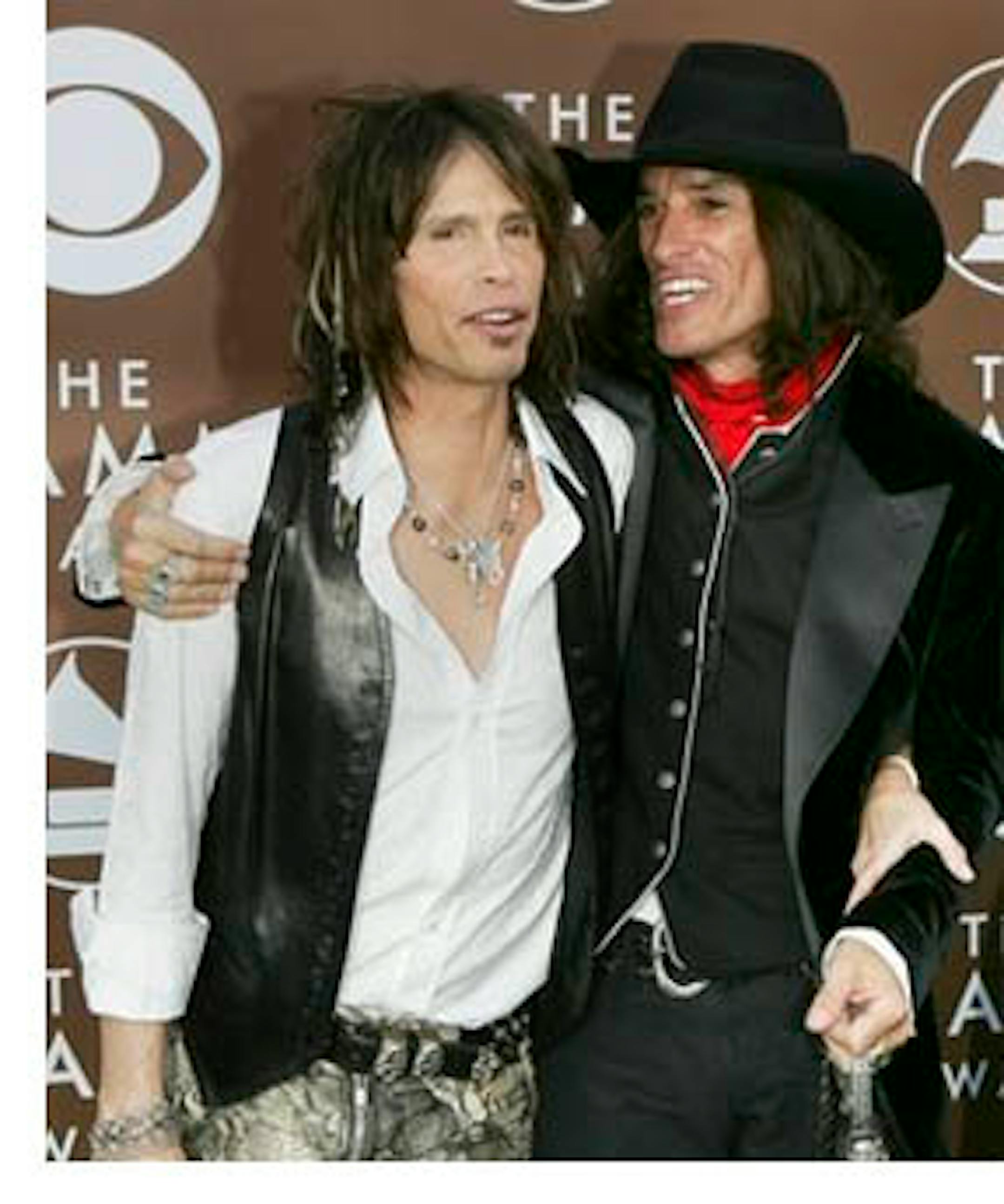 FILE - Steven Tyler, left, and Joe Perry of the group Aerosmith arrive for the 48th Annual Grammy Awards in this Feb. 8, 2006 file photo taken in Los Angeles. In an interview with Rolling Stone, Tyler says he and Joe Perry did drugs together in 2008 after years of sobriety. Tyler says Perry was so impaired by snorting prescription pills, he couldn't even play his instrument. Tyler says he was no better _ he couldn't sing. (AP Photo/Chris Carlson, File)