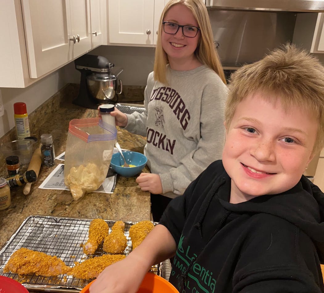 Maddy, 15, and Ben, 10, of Arden Hills, make crispy oven-fried chicken and cauliflower.