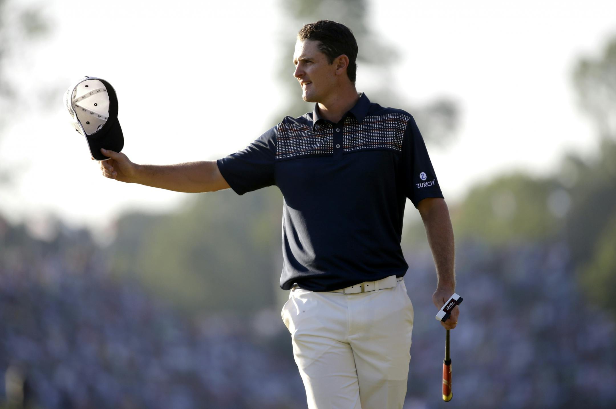 Justin Rose, of England, reacts after a putt on the 18th hole during the fourth round of the U.S. Open golf tournament at Merion Golf Club, Sunday, June 16, 2013, in Ardmore, Pa.