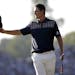 Justin Rose, of England, reacts after a putt on the 18th hole during the fourth round of the U.S. Open golf tournament at Merion Golf Club, Sunday, Ju