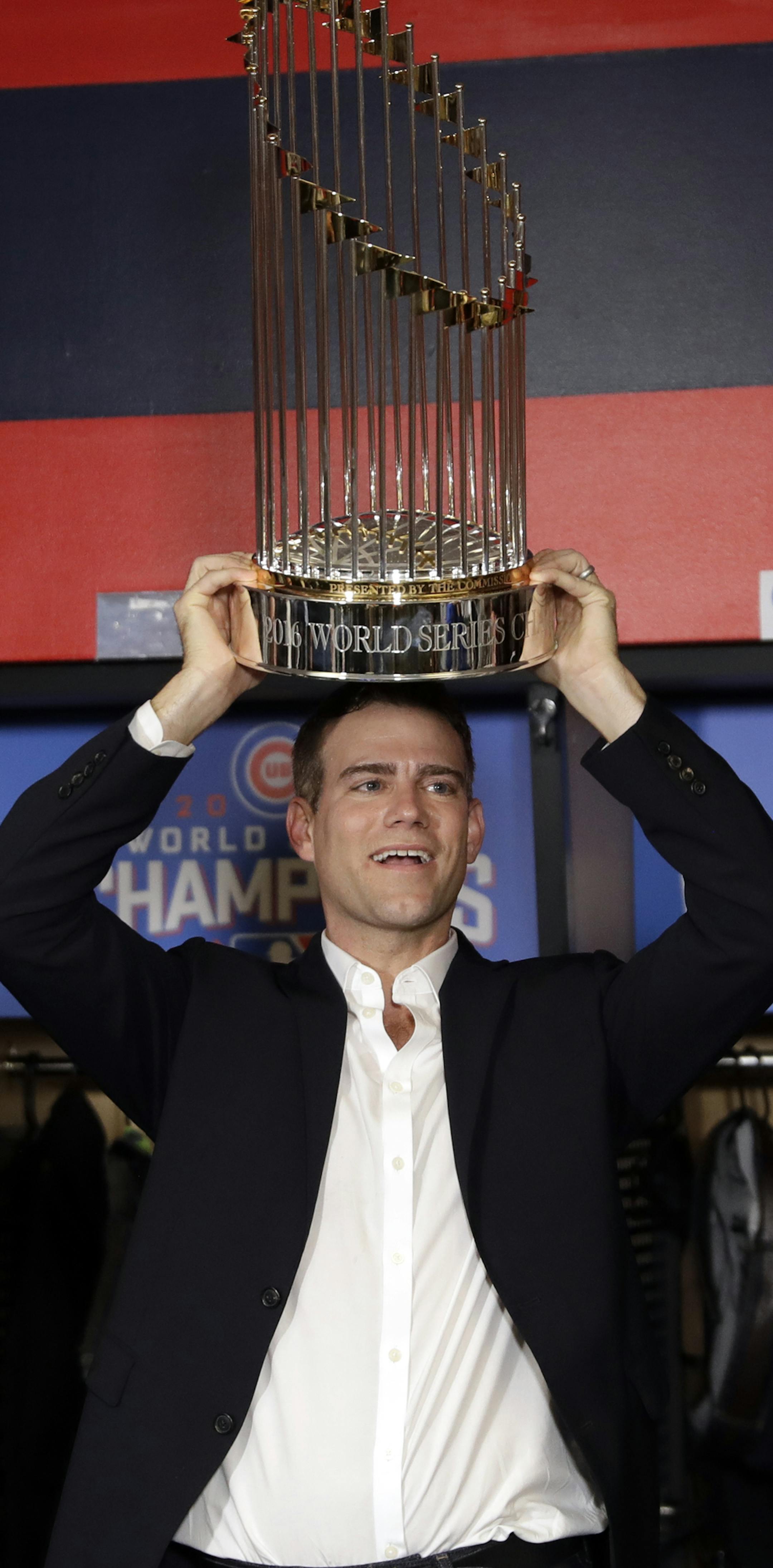 Chicago Cubs president for baseball operations Theo Epstein celebrates after Game 7 of the Major League Baseball World Series Thursday, Nov. 3, 2016, in Cleveland. The Cubs won 8-7 in 10 innings to win the series 4-3. (AP Photo/David J. Phillip)