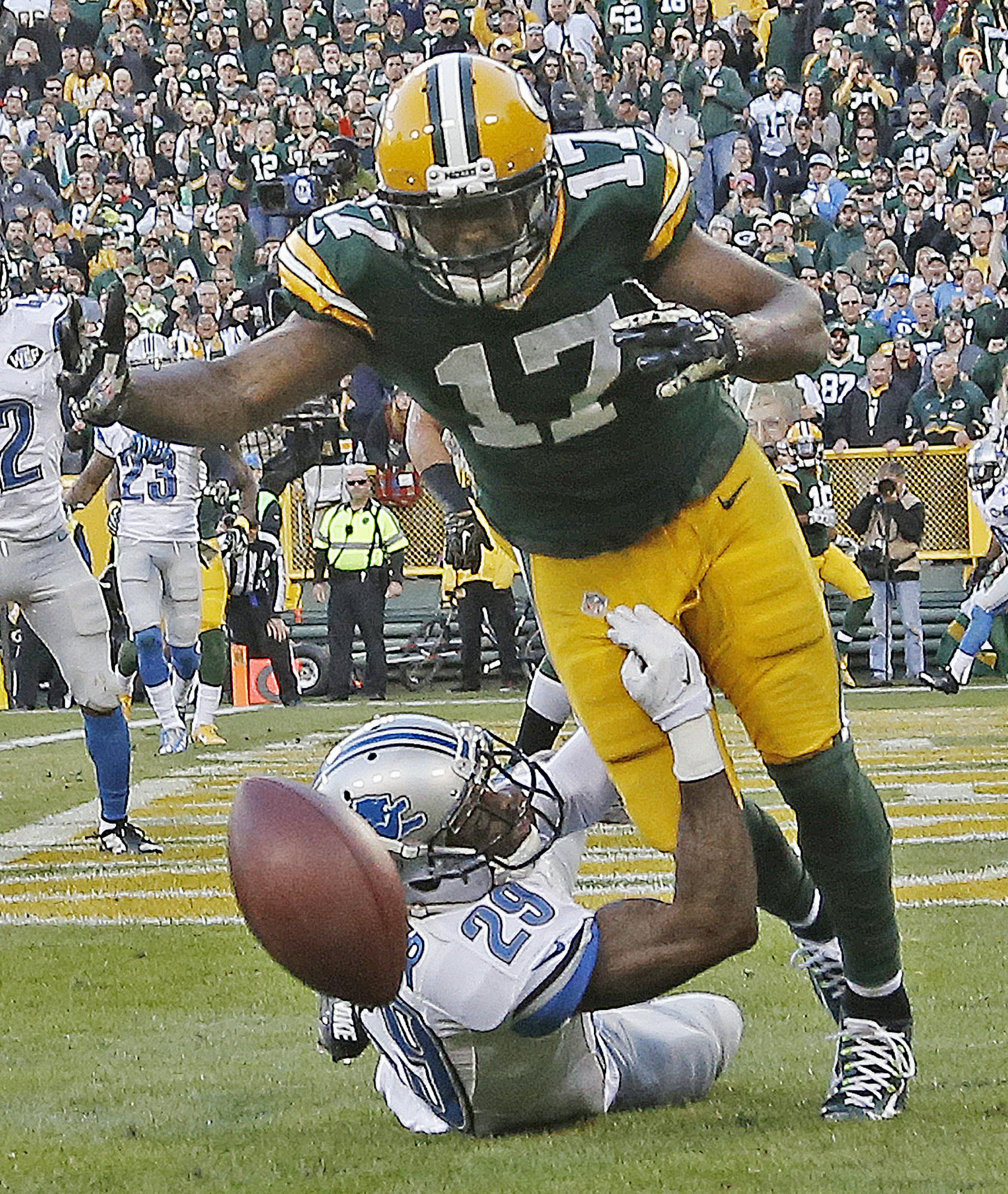 Detroit Lions' Crezdon Butler breaks up a two-point conversion intended for Green Bay Packers' Davante Adams (17) during the second half of an NFL football game Sunday, Nov. 15, 2015, in Green Bay, Wis. The Lions won 18-16. (AP Photo/Morry Gash)