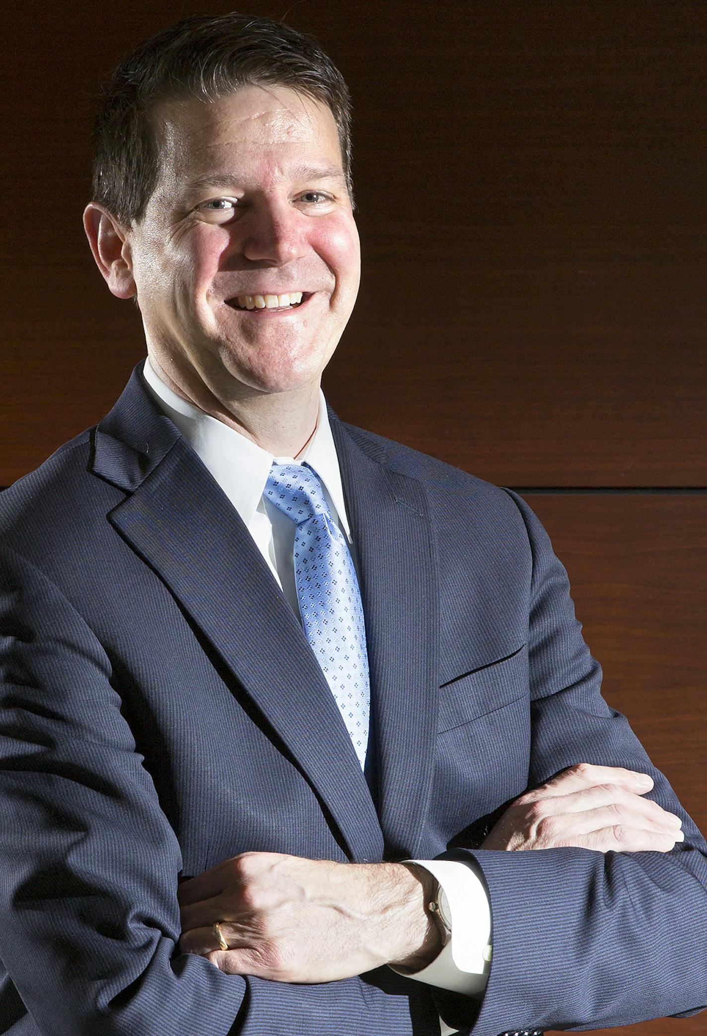 Chris Clark, the new president of Xcel Energy's Upper Midwest division poses for a photo at their downtown Minneapolis headquarters on Friday, January 2, 2015. ] LEILA NAVIDI leila.navidi@startribune.com /