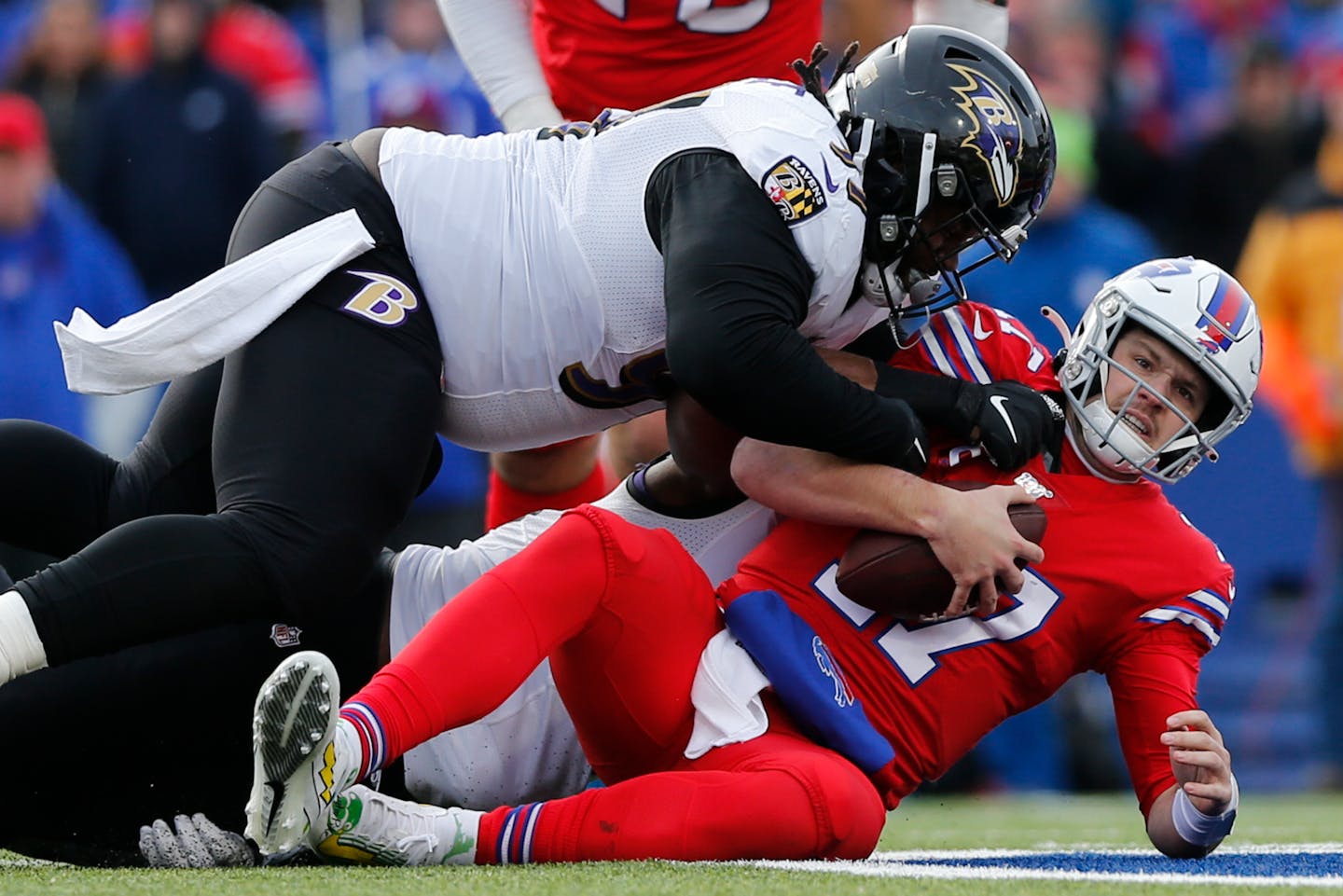 Buffalo Bills quarterback Josh Allen (17) is sacked by Baltimore Ravens defensive tackle Michael Pierce (97) during the first half of an NFL football game in Orchard Park, N.Y., Sunday, Dec. 8, 2019. (AP Photo/John Munson)