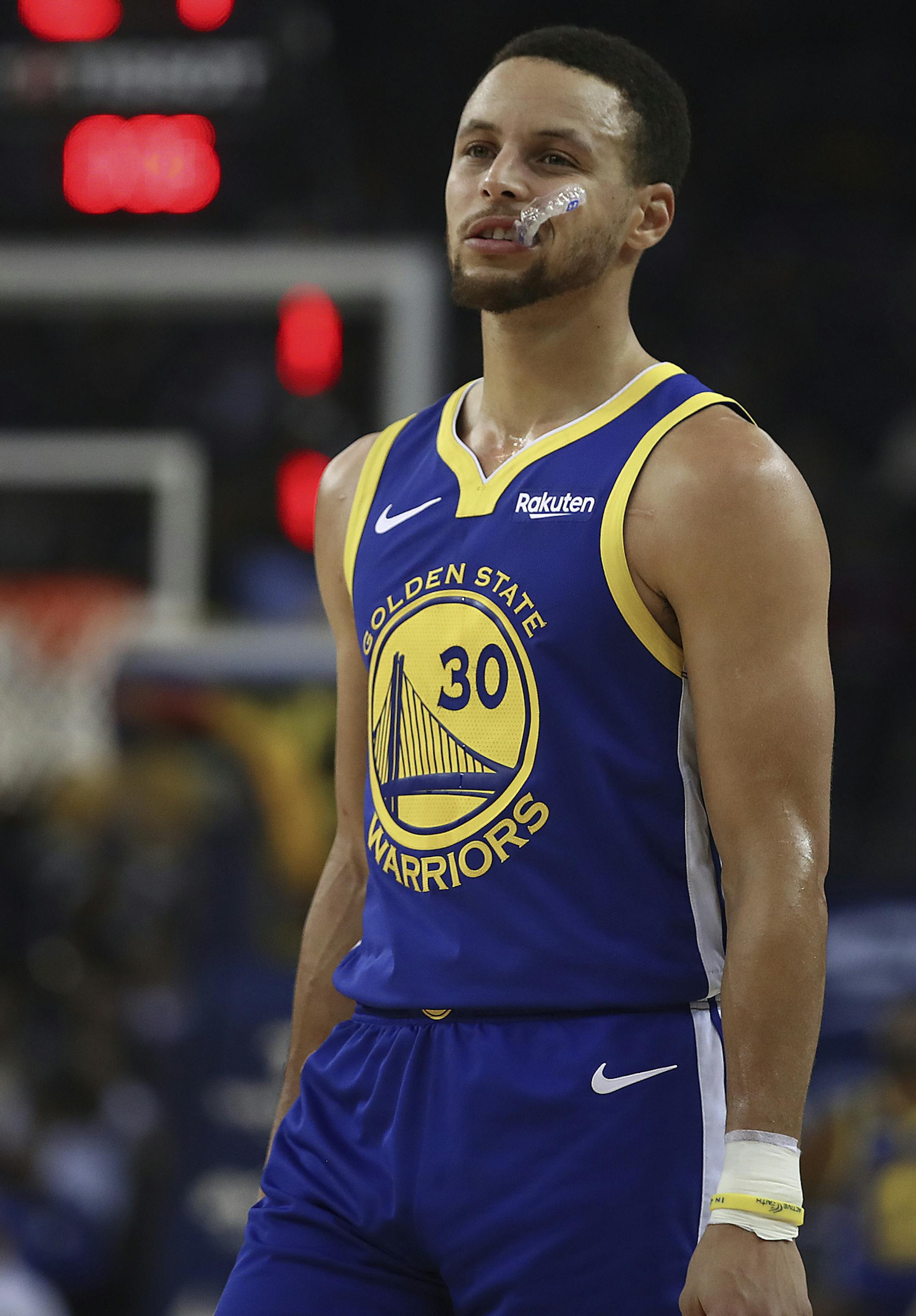 Golden State Warriors' Stephen Curry during a timeout in the first half of an NBA basketball game against the Minnesota Timberwolves Monday, Dec. 10, 2018, in Oakland, Calif. (AP Photo/Ben Margot)