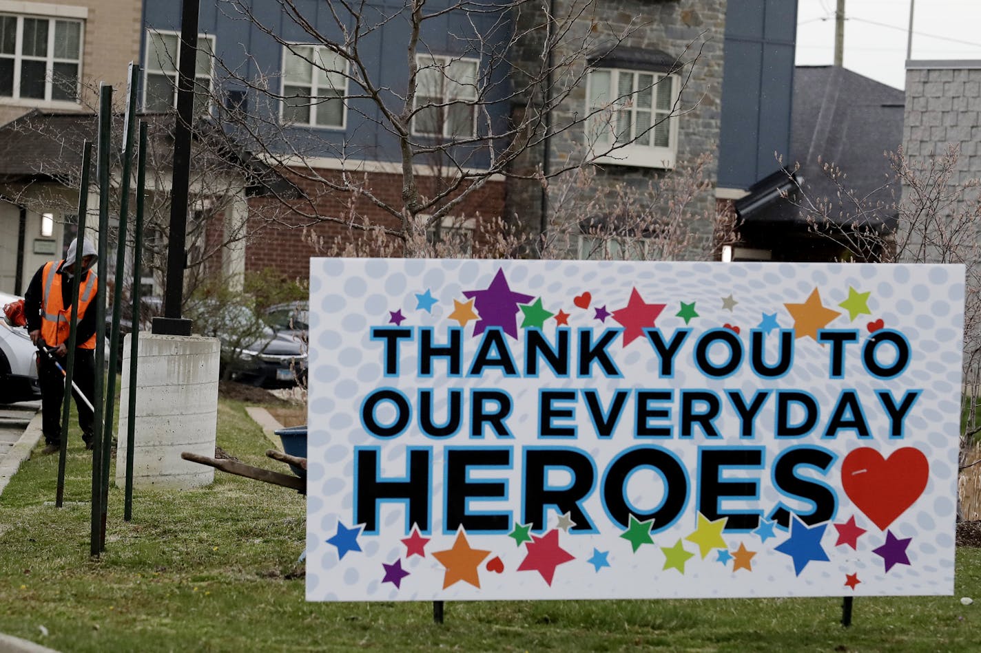 A sign thanking essential workers is displayed at Aspired Living of Prospect Heights in Prospect Heights, Ill., Wednesday, April 22, 2020. Many seniors depend on assisted living facilities. Now coronavirus is threatening the industry. (AP Photo/Nam Y. Huh)