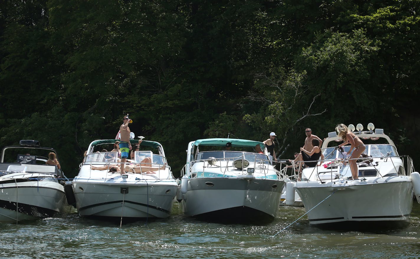 Boats line up, tied together on Lake Minnetonka on Saturday, August 3, 2013. ] (ANNA REED/STAR TRIBUNE) anna.reed@startribune.com (cq)